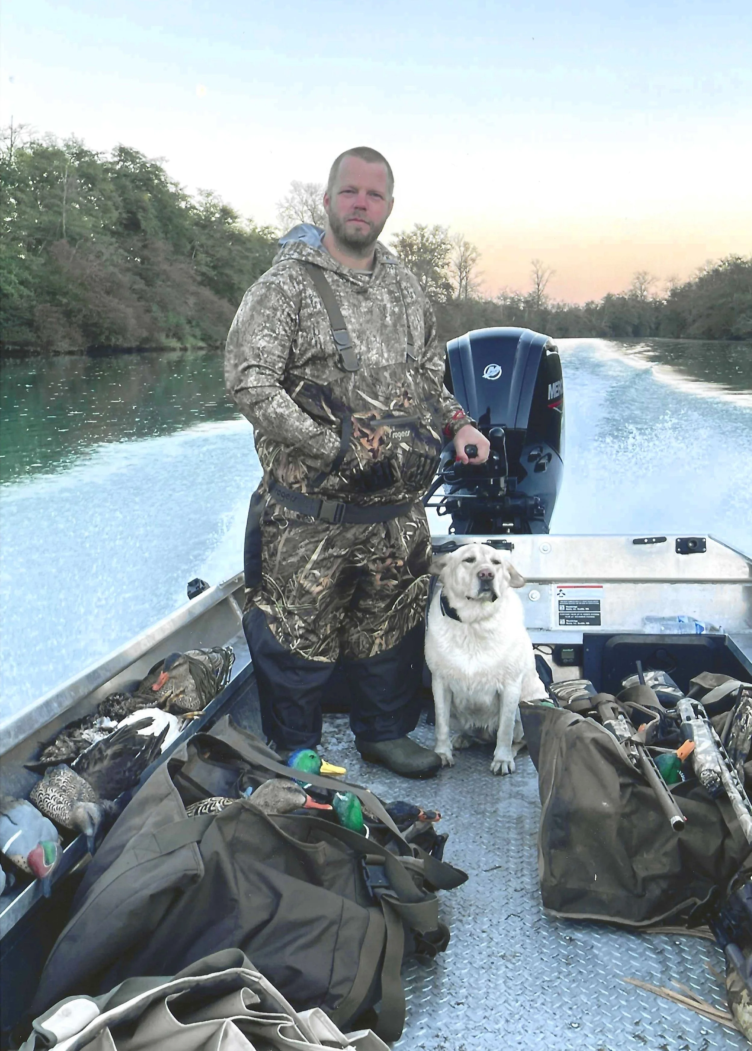 The owner of Wyman Guide Service running the lower channels of the Skagit River for ducks.