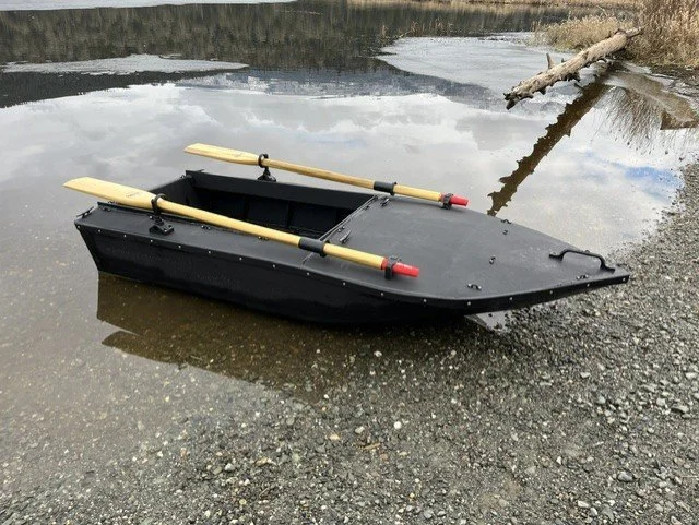 The welded HDPE layout boat after its maiden voyage on a local lake.