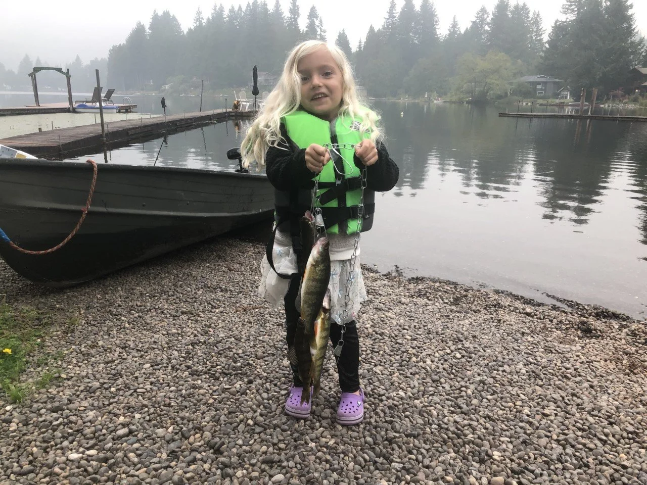 My daughter showing off her stringer of perch in Skagit County.