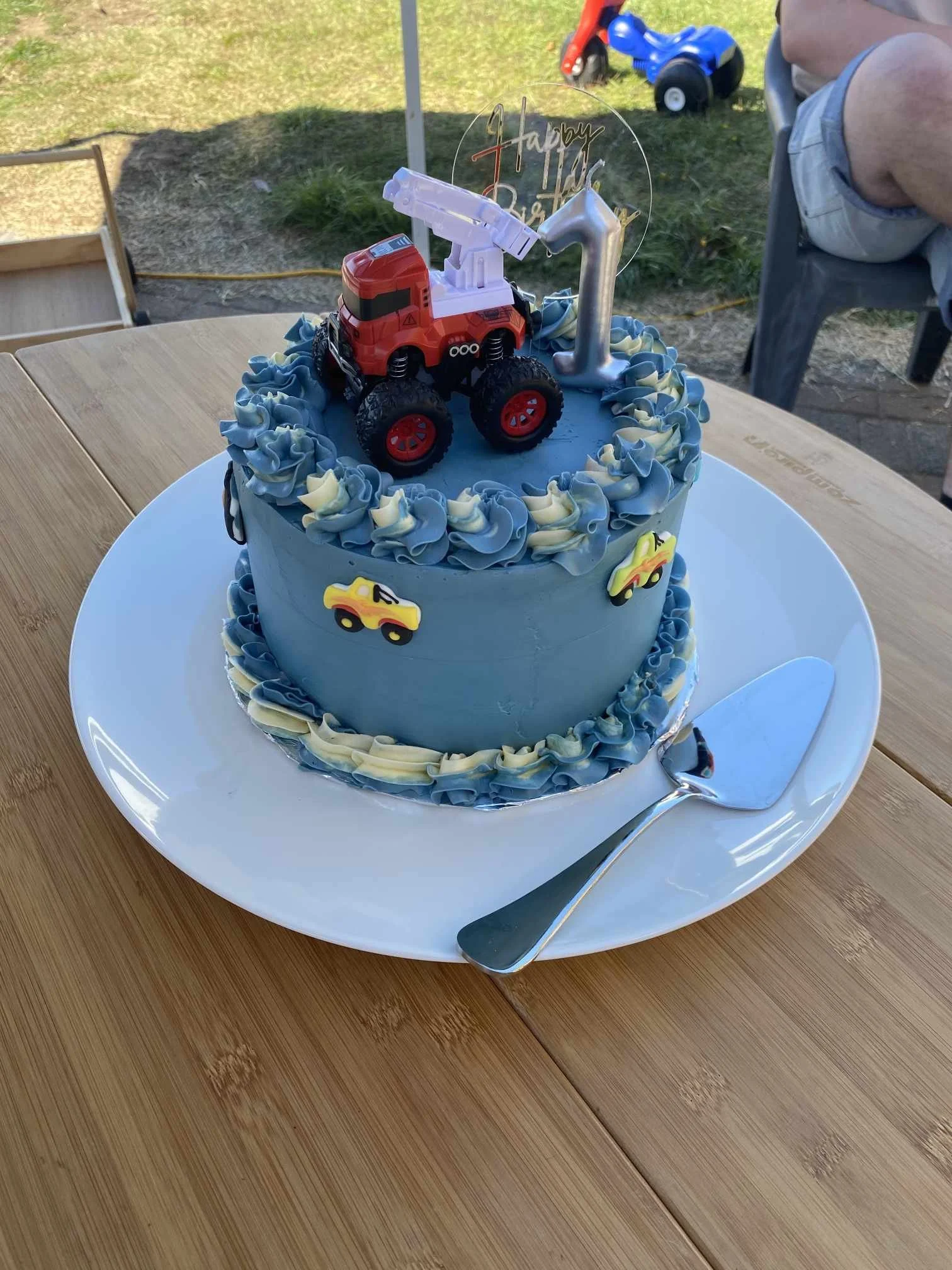A classic buttercream cake finished in smooth icing and topped with a bold monster truck topper. Clean, simple, and perfect for a truck-loving birthday.