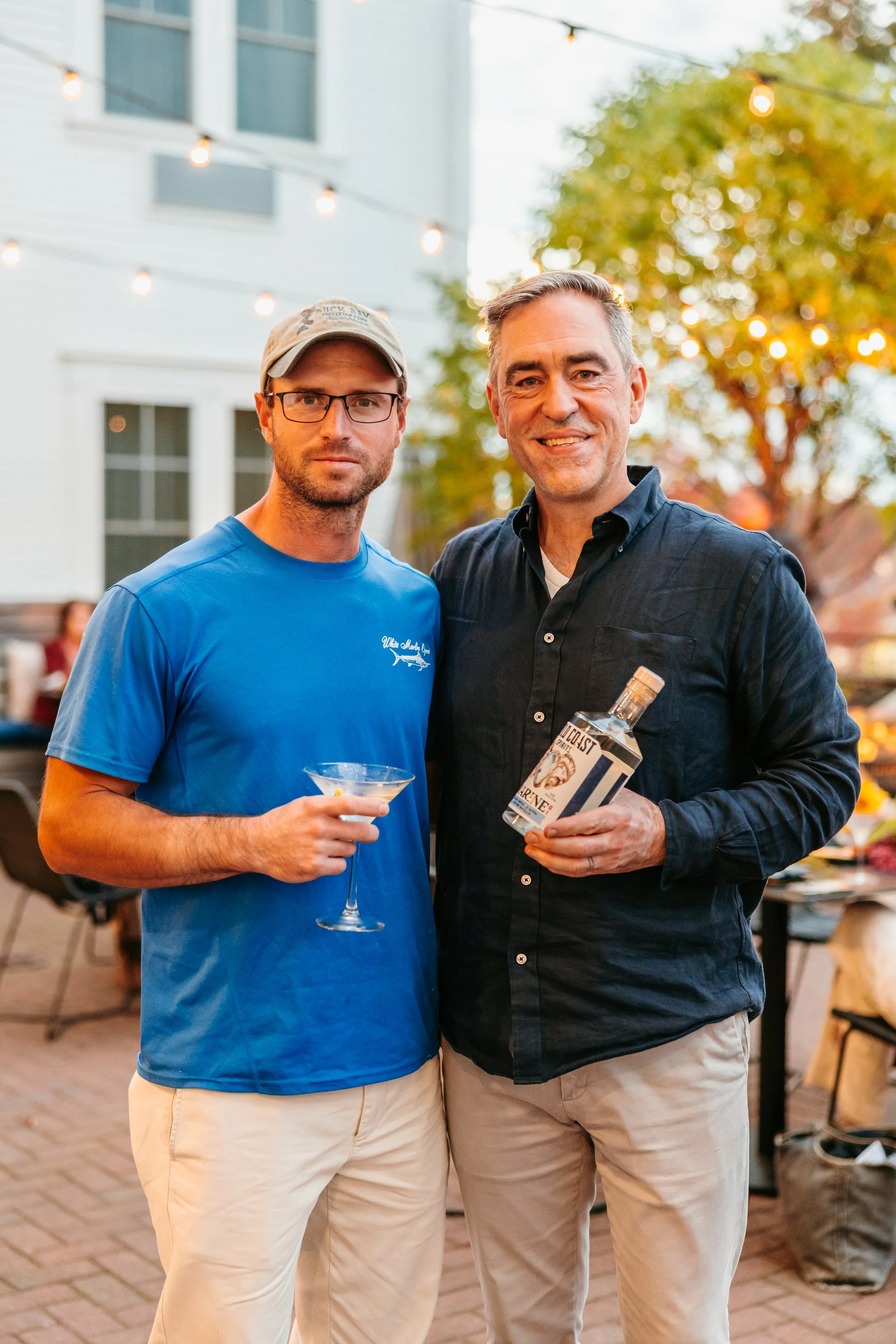 Oyster farmer Sean Corcoran, left, standing with Bold Coast Spirits co-founder Jay Lombard