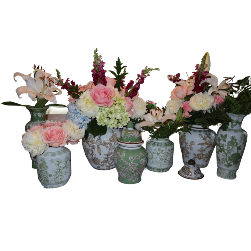 Set of seven decorative flower vases with various pink and white flowers, arranged on a white background.