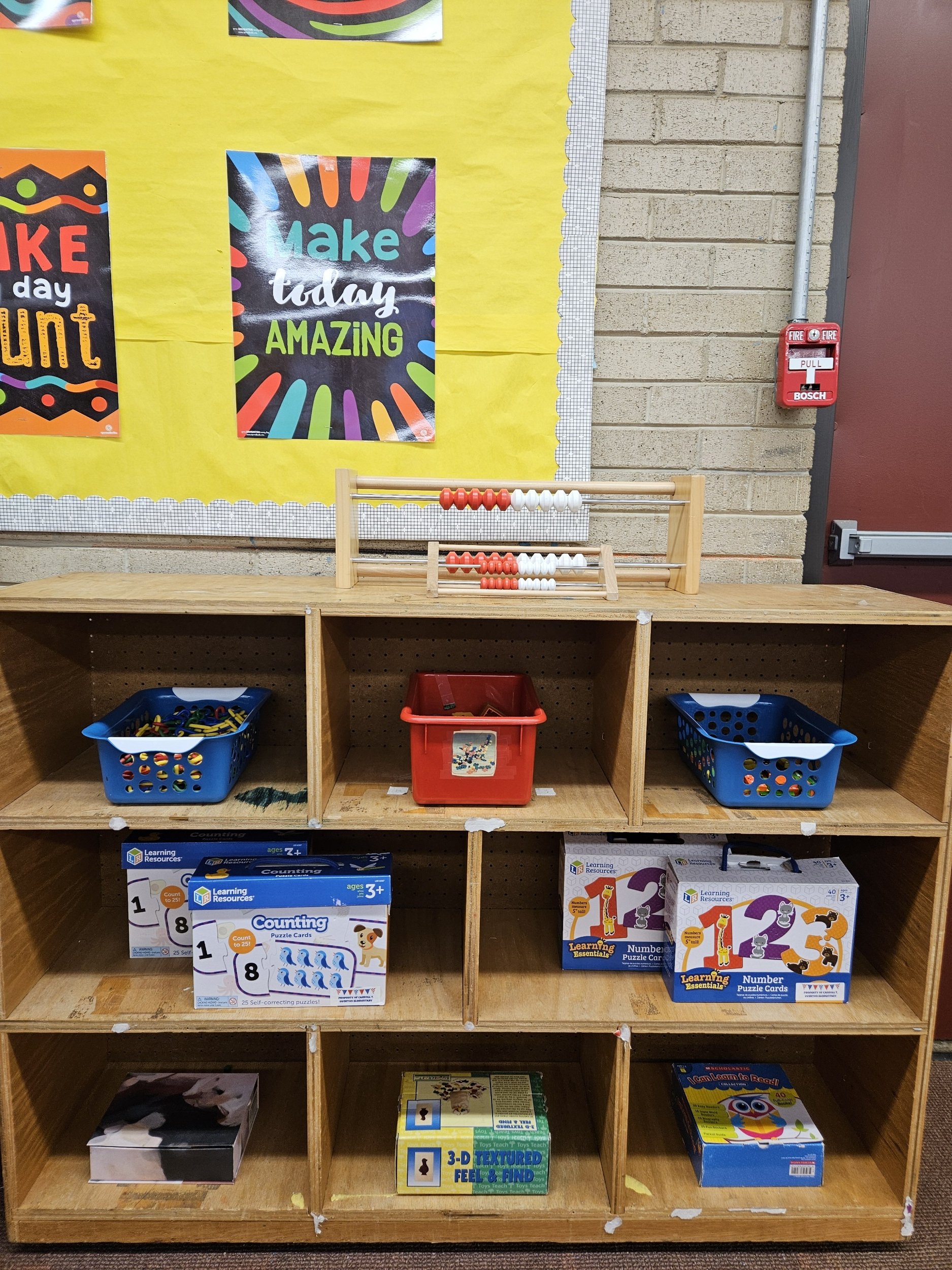 Board games and toy boxes on shelves.