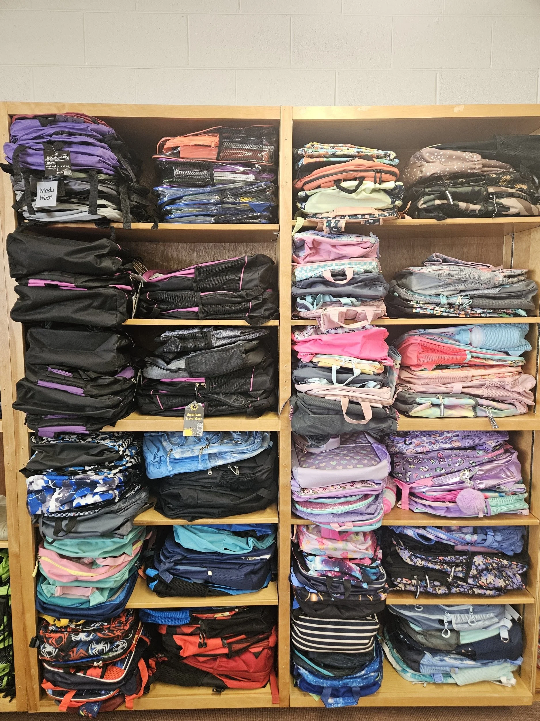 Book bags stocked on shelves.