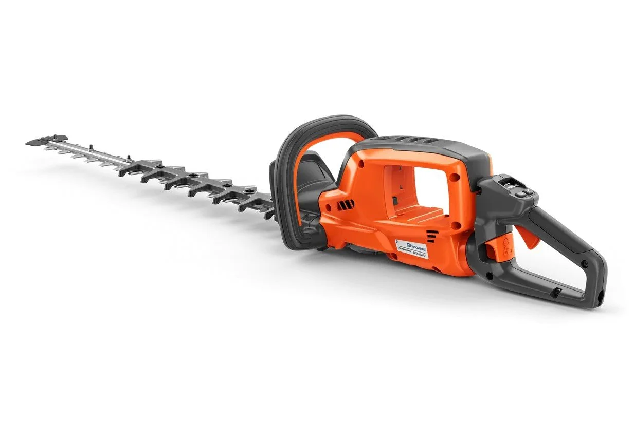 Husqvarna Electric hedge trimmer with an orange and black body, black blade, and handle.