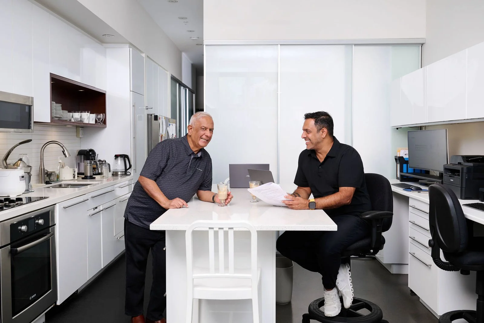 Rahim and Nizar Rayani discussing a client’s business at xBooks