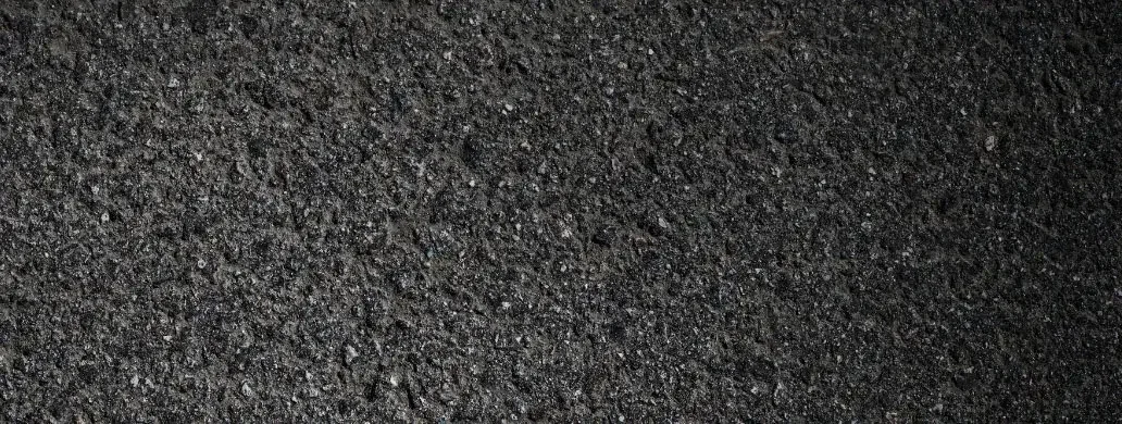 Close-up of black asphalt surface.