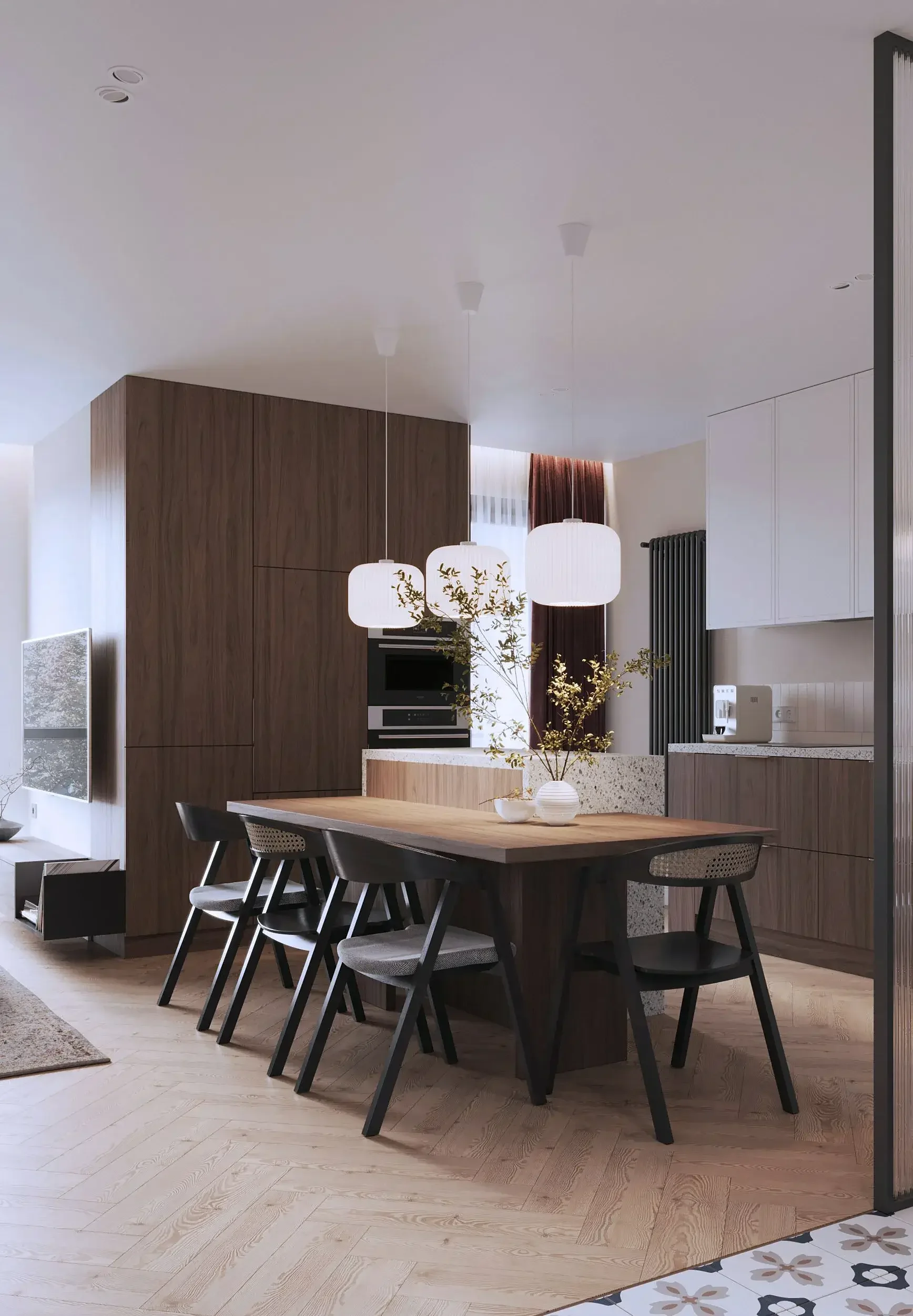 Modern kitchen and dining area with a wooden table, black chairs, and pendant lights, featuring light wood flooring, a wooden cabinet, white kitchen cabinets, and decorative vases with greenery.