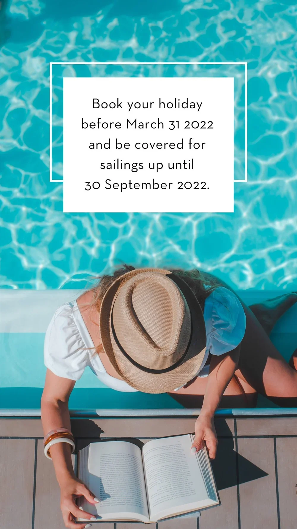 A woman sitting by a poolside, reading a book, wearing a hat, with pool water in the background.