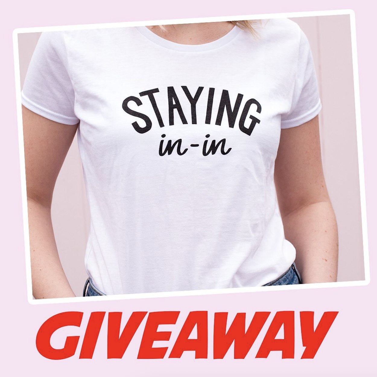 A woman wearing a white t-shirt with the text "Staying in-in" printed on it. The background is light pink, and the word "GIVEAWAY" is written in large red letters at the bottom.