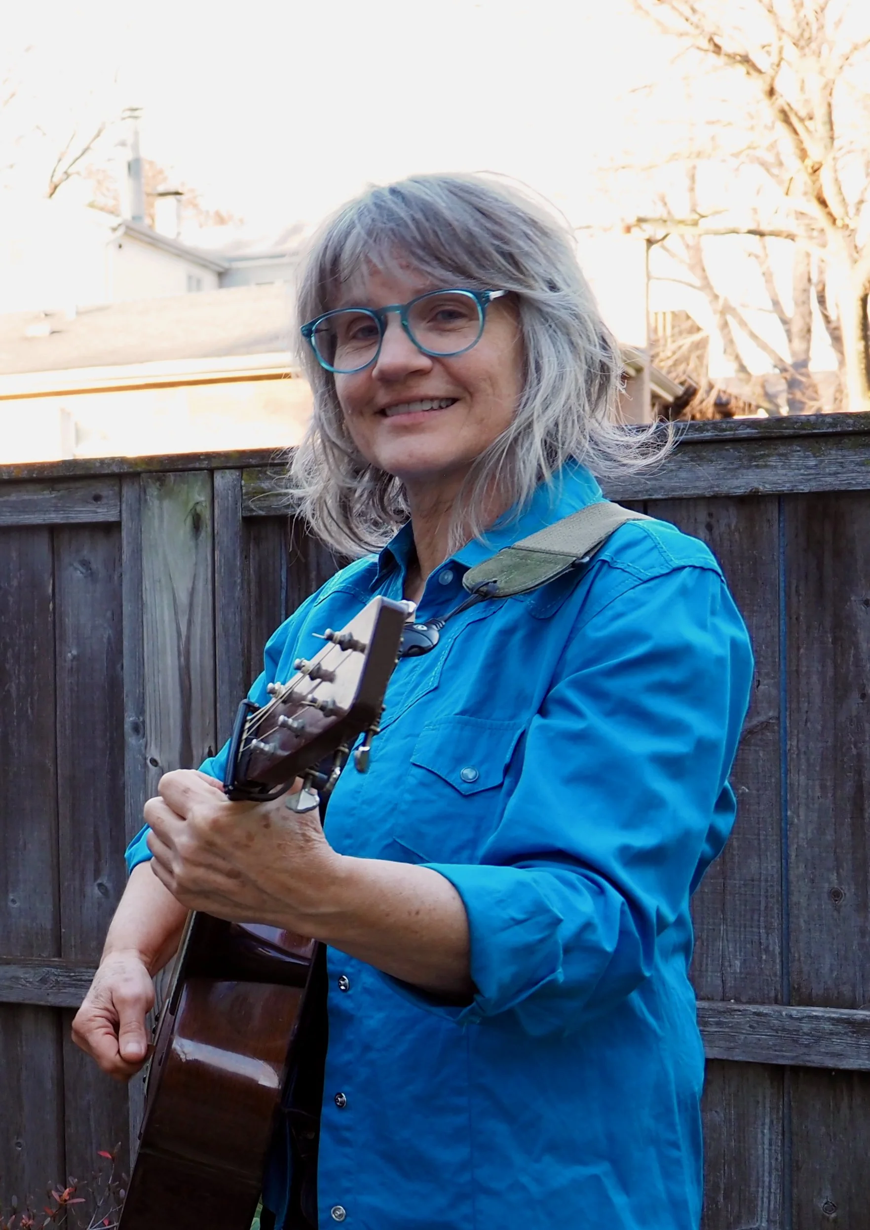 Mitzi Lebensorger holds her guitar