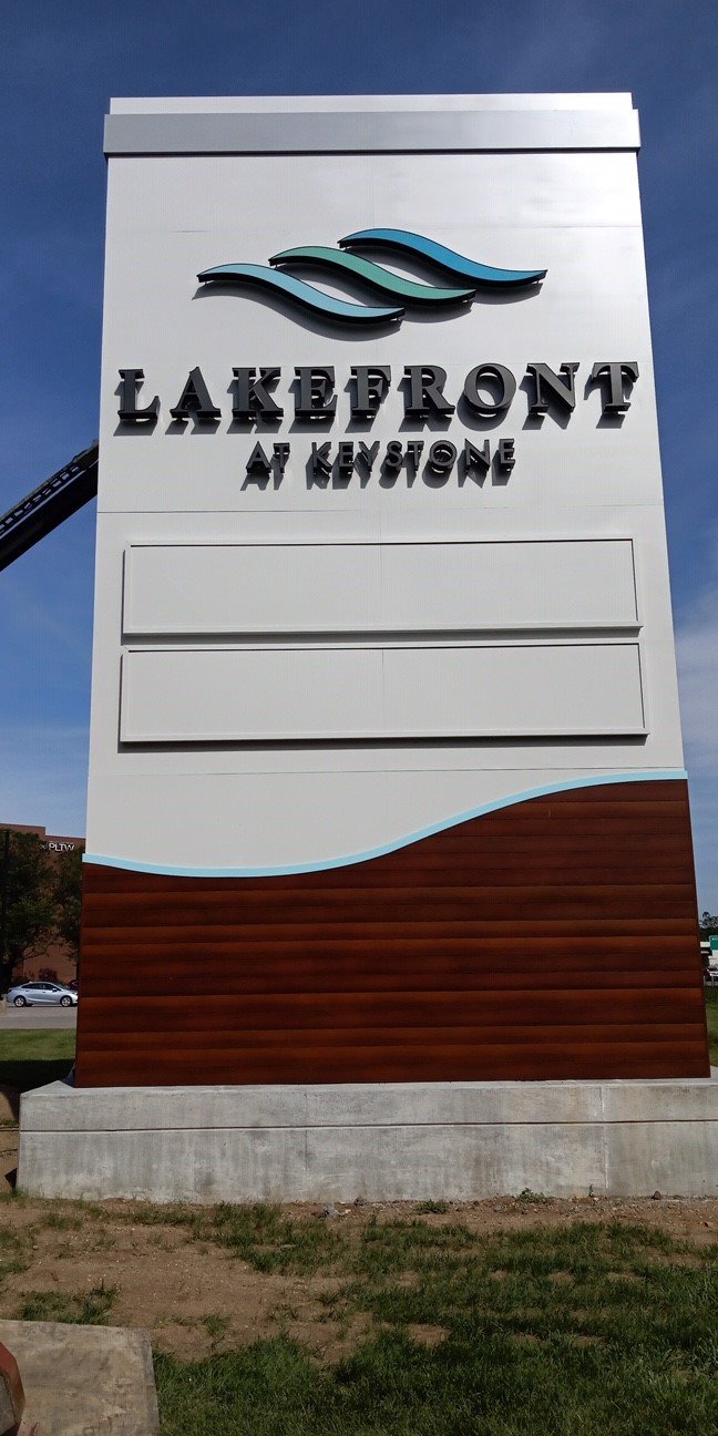 Sign for Lakefront at Keystone development with stylized water waves logo