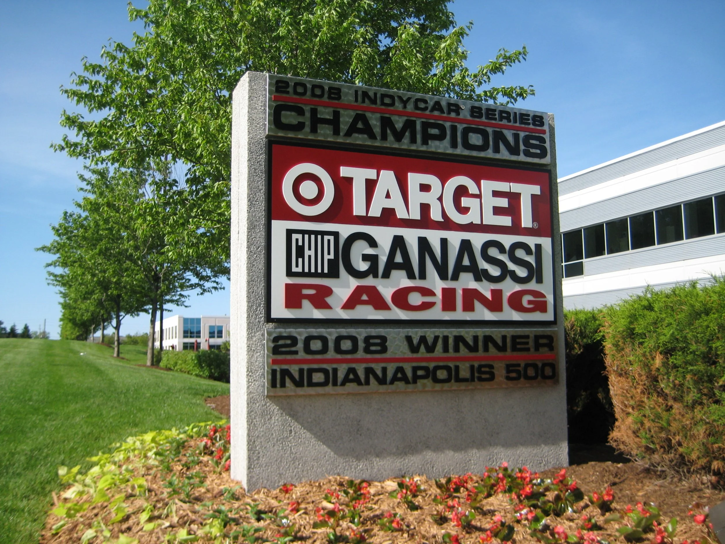 A monument celebrating the 2008 IndyCar Series champion Ganassi Racing with a Target logo and the text '2008 winner Indianapolis 500' at the Indianapolis Motor Speedway.