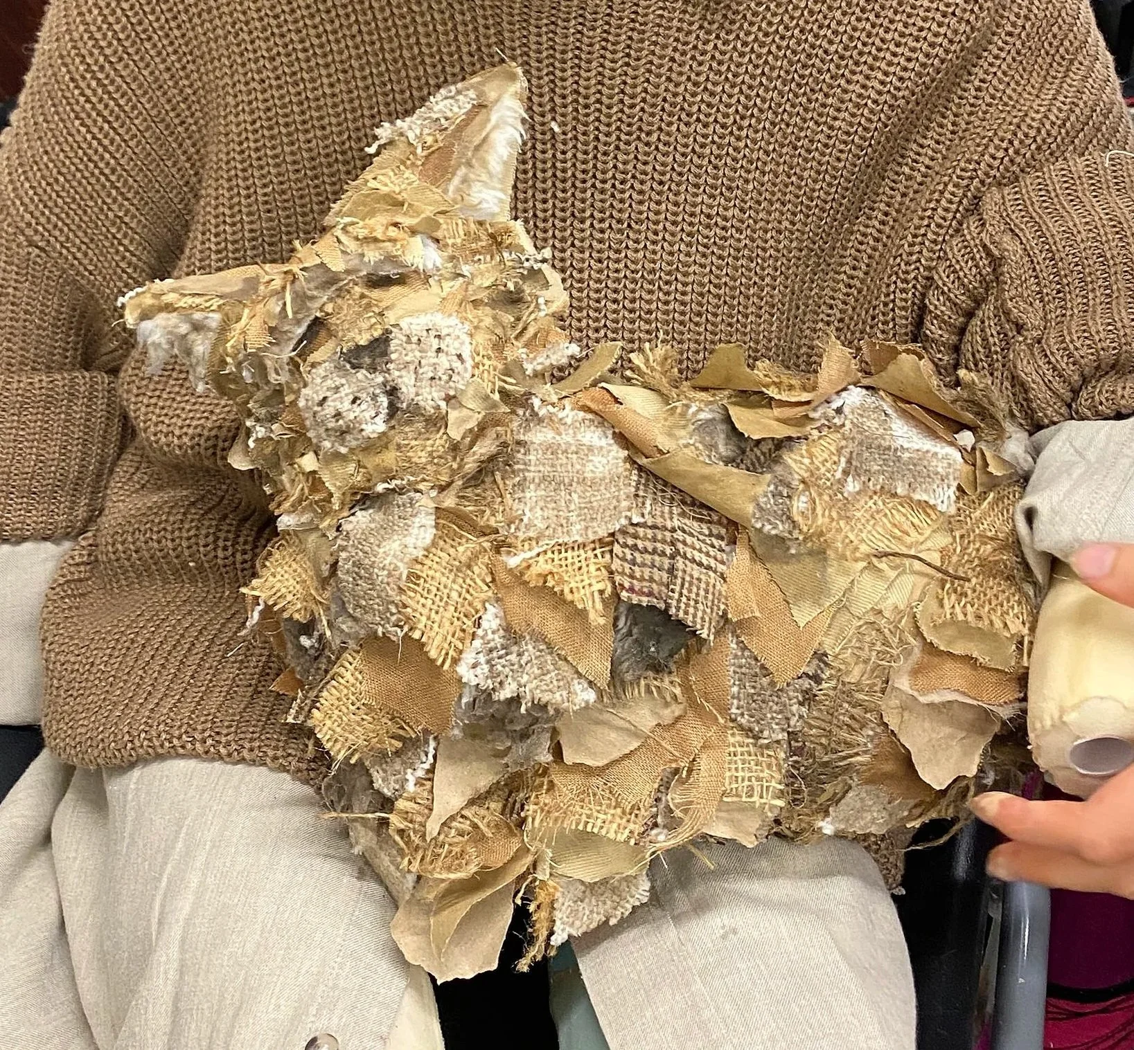 Sewed the cat (pre-reveal) like a skin that could be taken on and off. I patchworked it like the mans face but more scraggly and dirty.