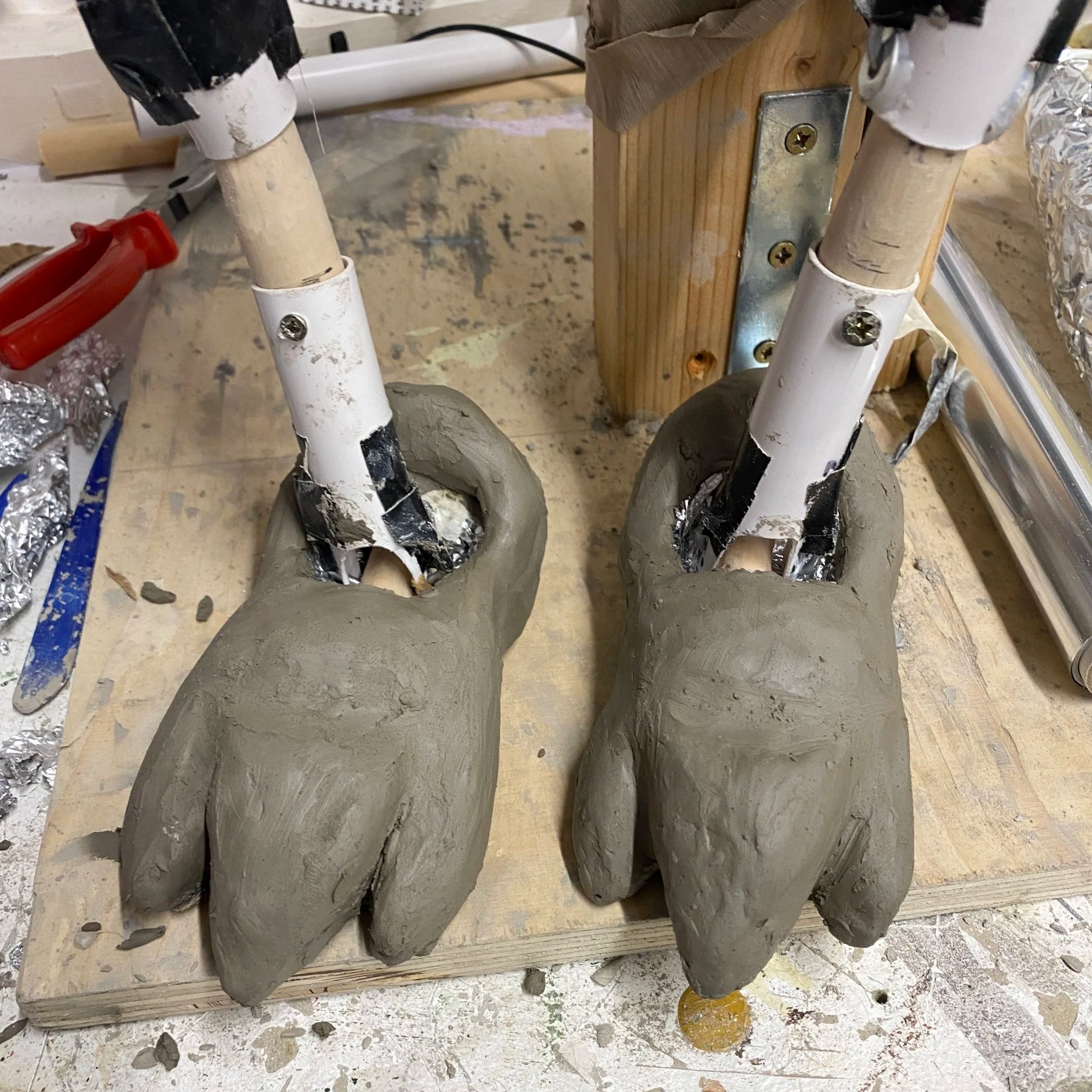 Sculpted the feet out of clay.