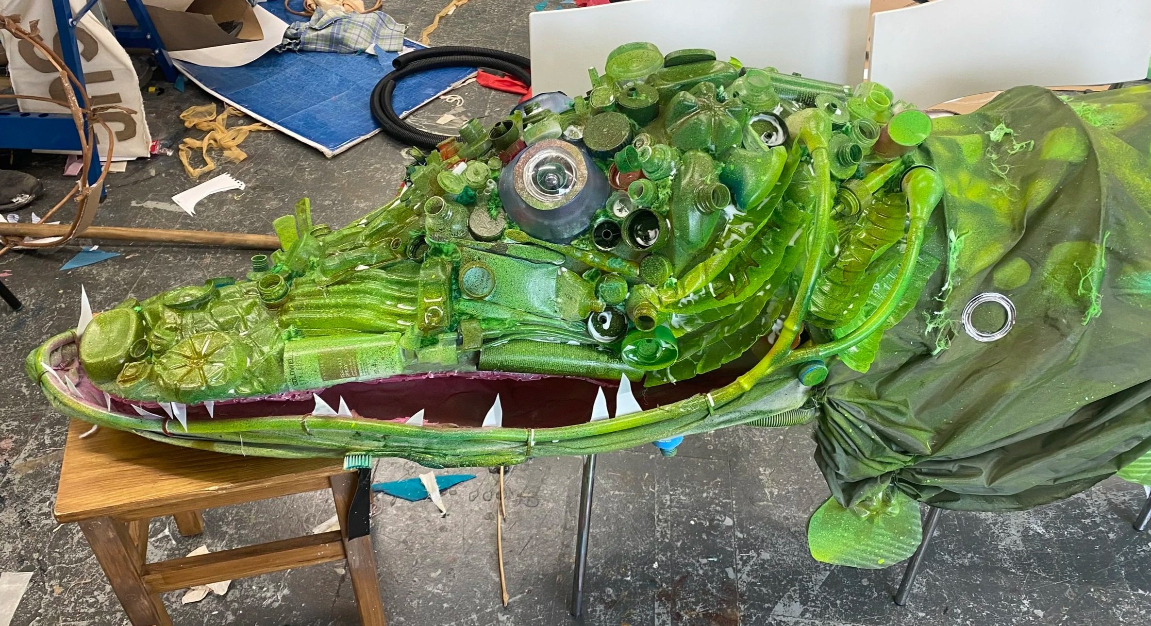 Spray painted it green then speckled it with other colours like brown, neon pink and neon yellow. Also spray painted the inside of the mouth and added teeth. 