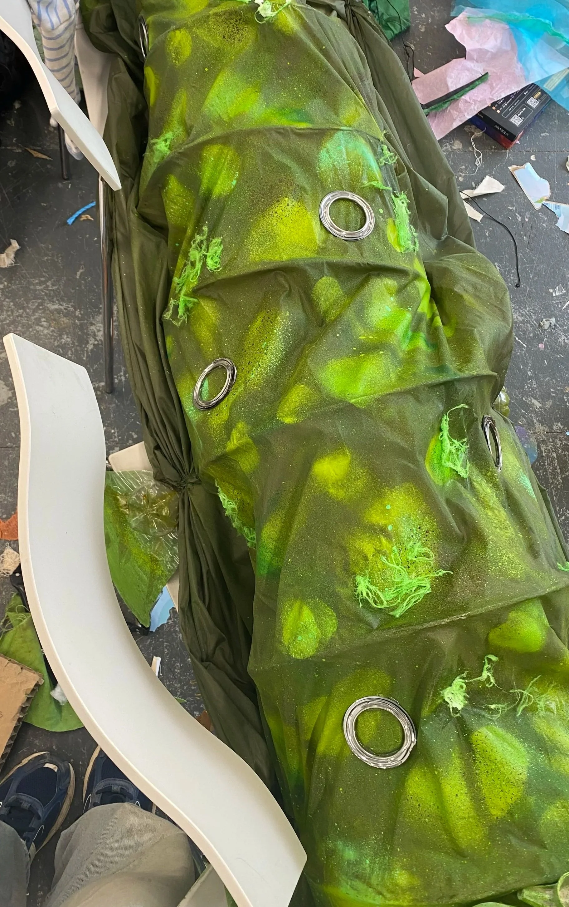 Glued the shower curtain hangers to the body used a stencil to make scales. 