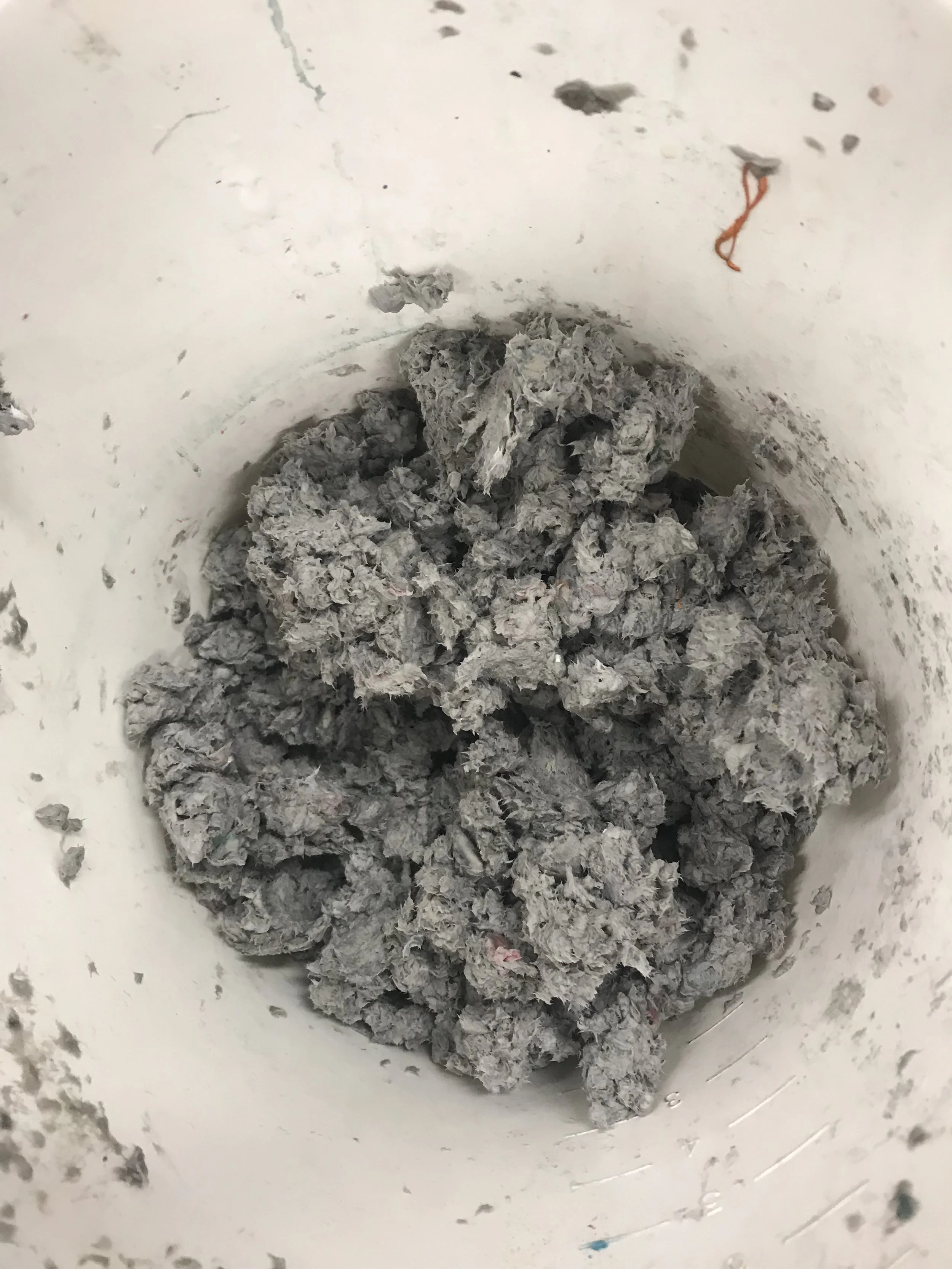 Blitzed up the soaked paper, wringed all the water out and added pva to make paper pulp