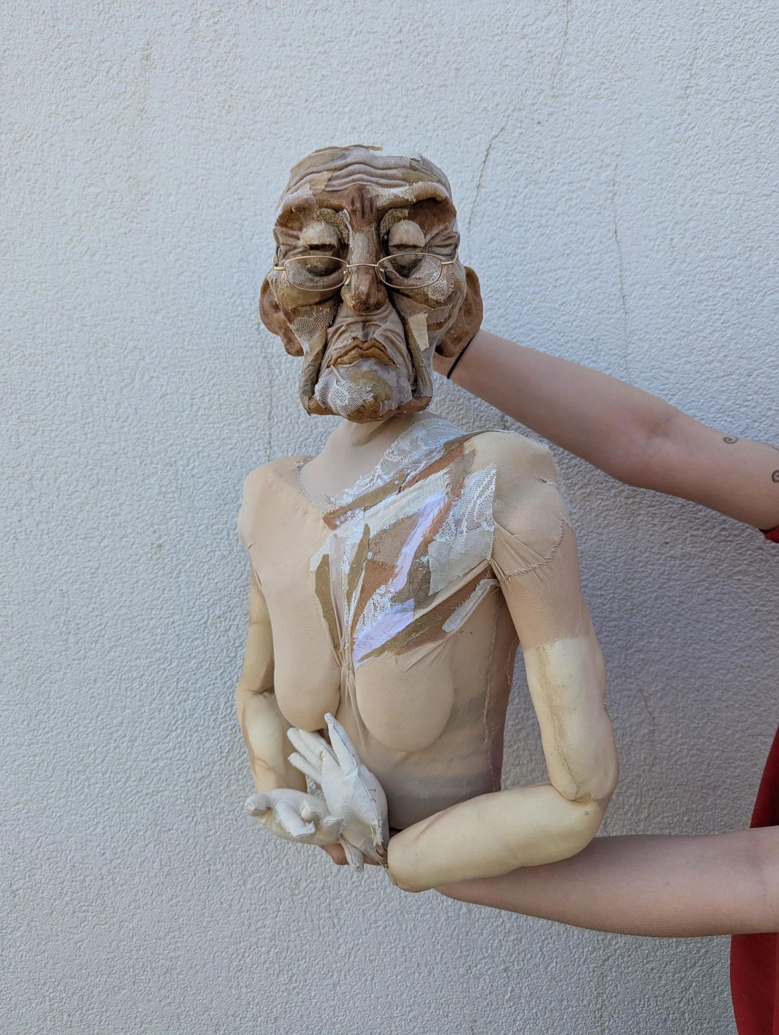 Covered her body in the same patchworking and painted into the face 