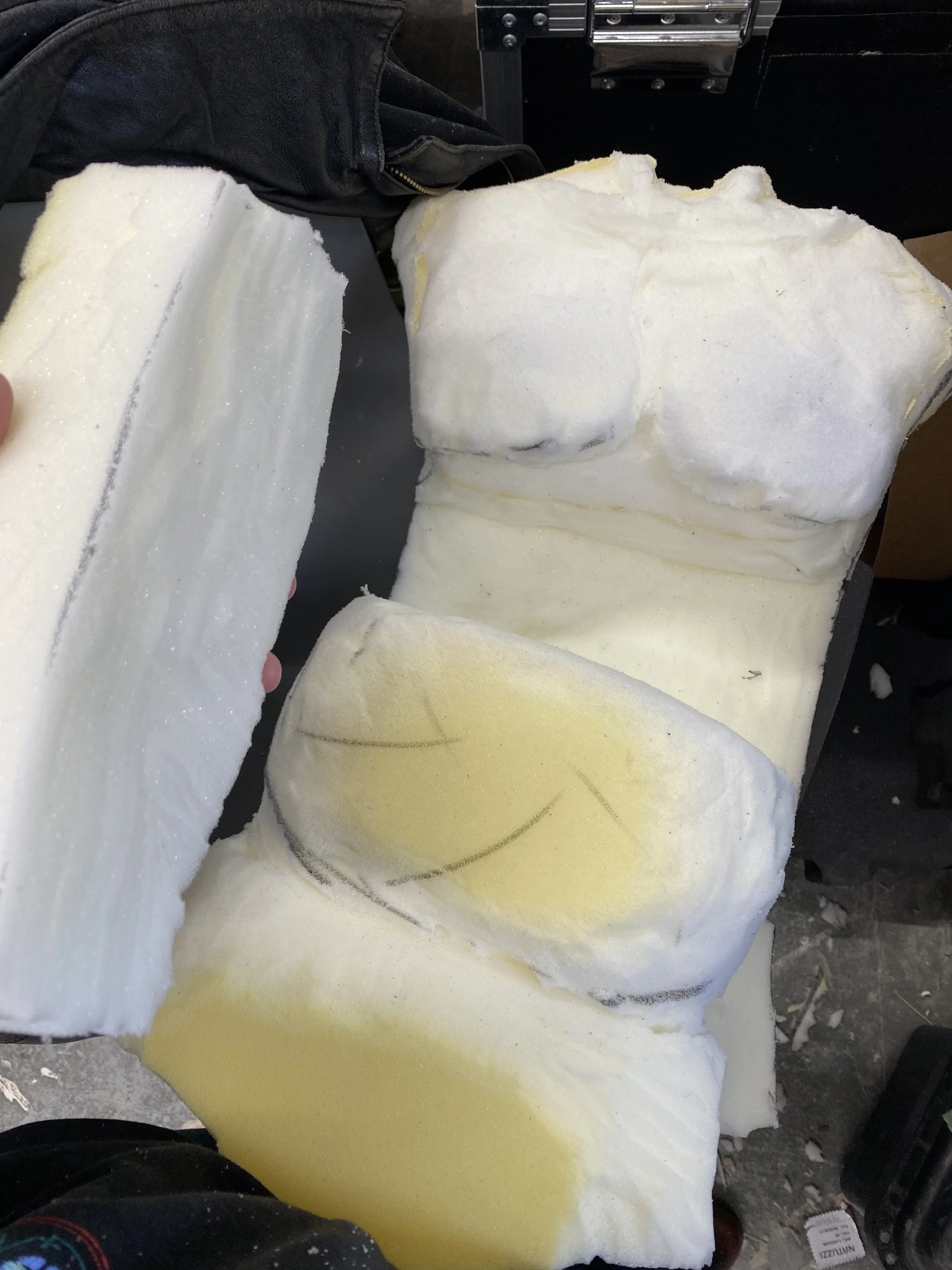 Carving the foam and cutting it in to sections so the puppet can bend and sit down