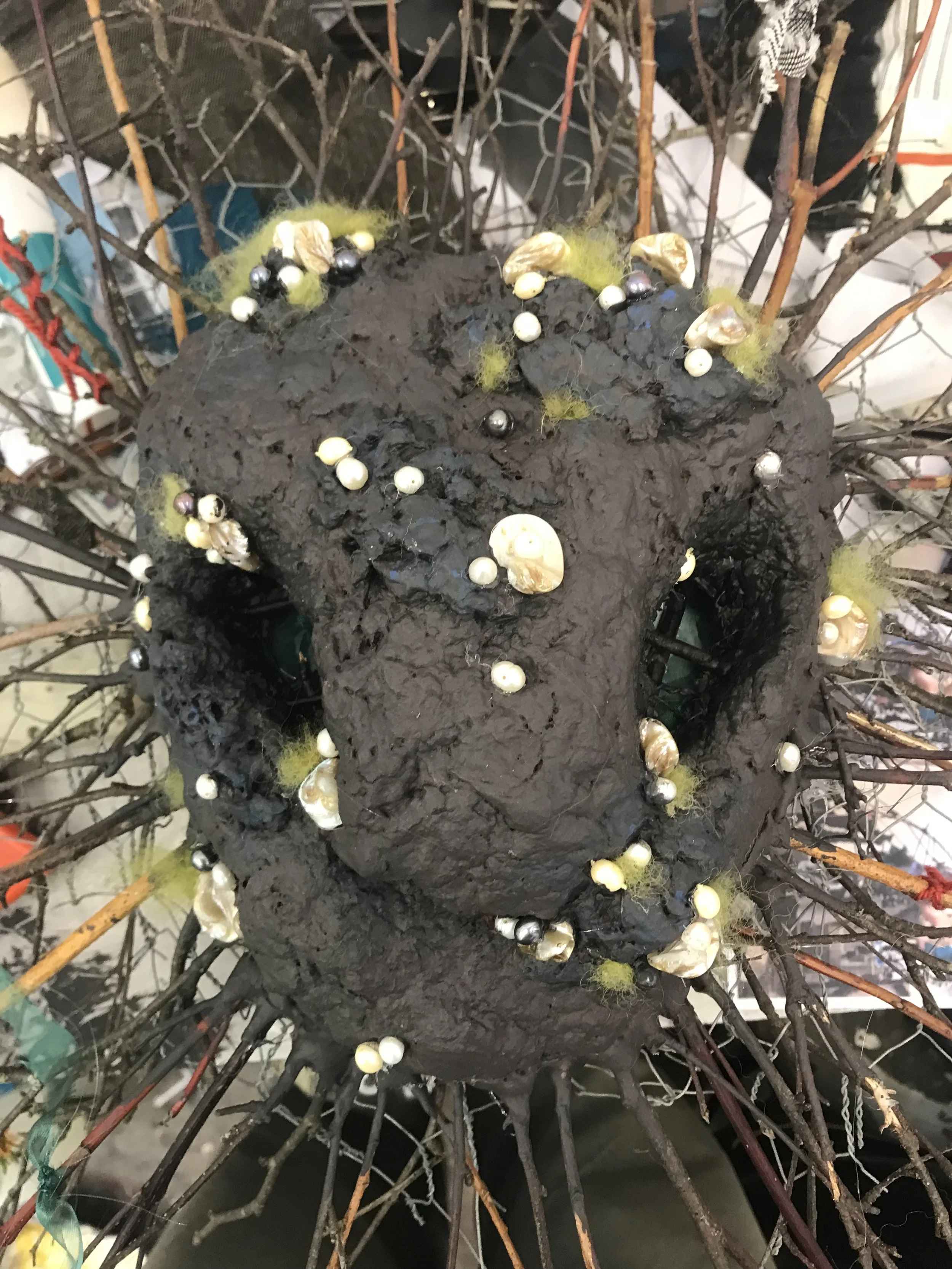 Painted the face and added pearls and cotton wool painted to look like moss.