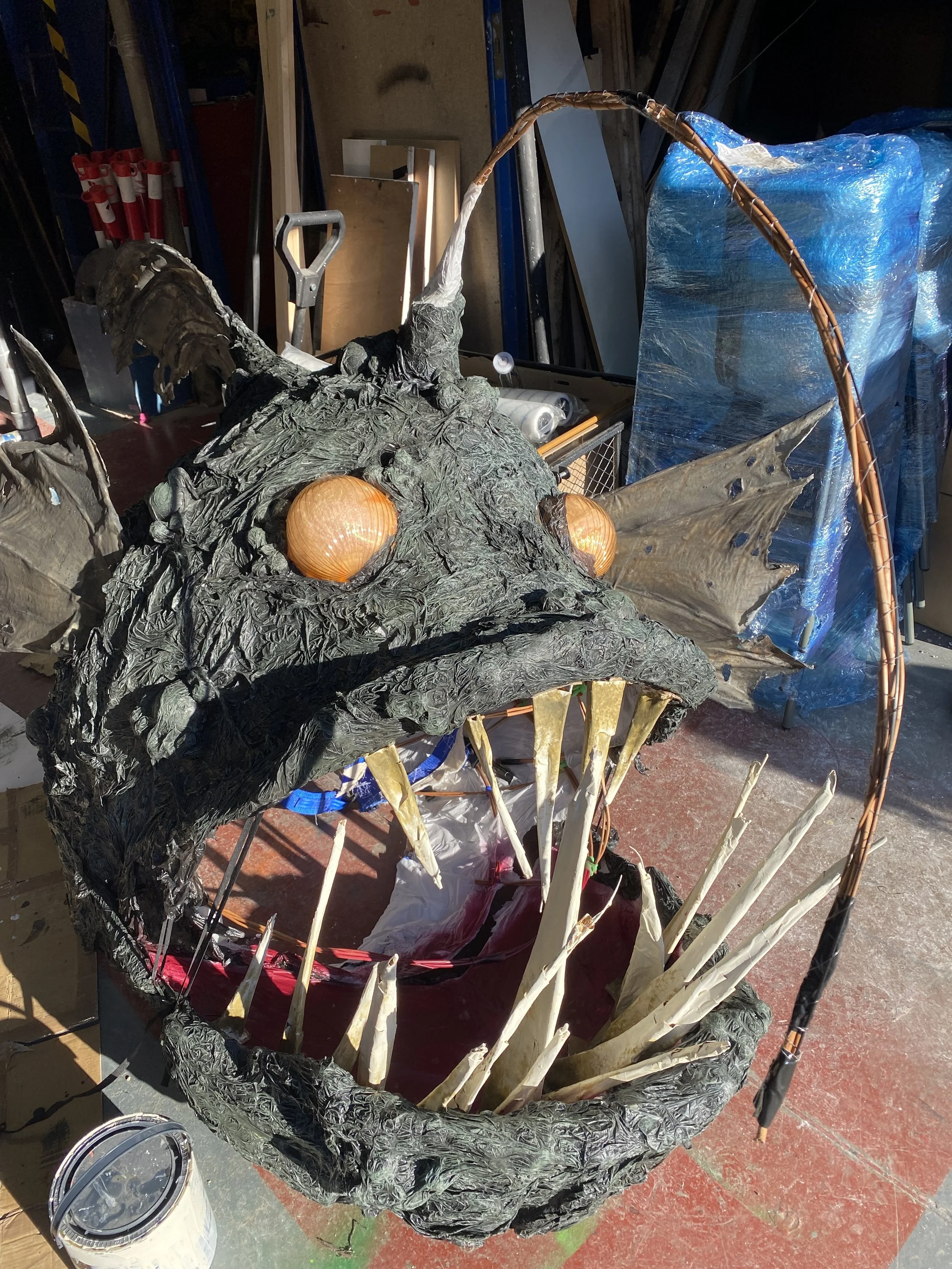 Added sharp teeth made from withy and paper, then spray painted the mouth and dry brushed the skin texture. 