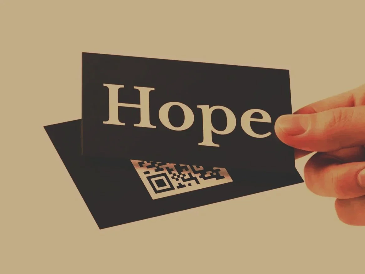 male-hand-holding-business-card-mockup.jpg