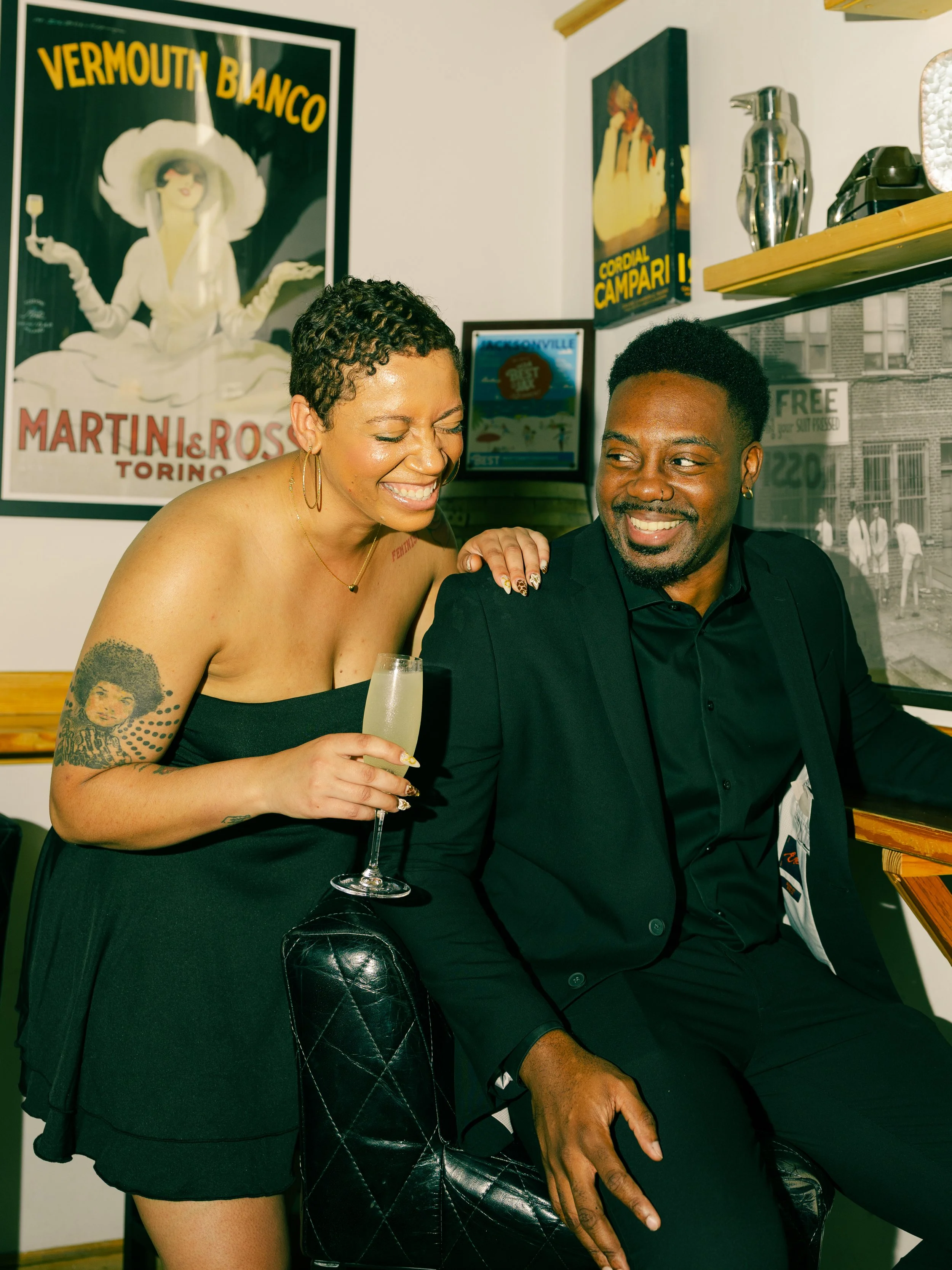 A couple sharing a drink at Grape and Grain Exchange, a wine bar in San Marco, a neighborhood in Jacksonville, Florida.