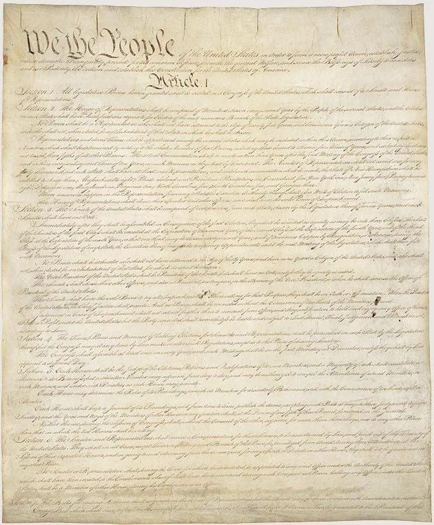 The United States Declaration of Independence, starting with 'We the People' at the top.