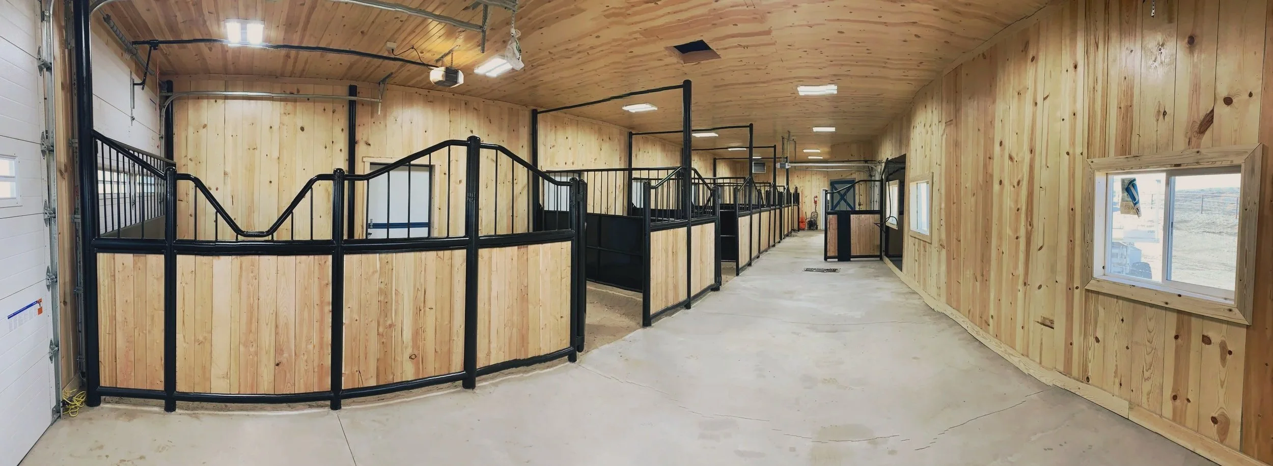 Stable with custom stalls and iron work