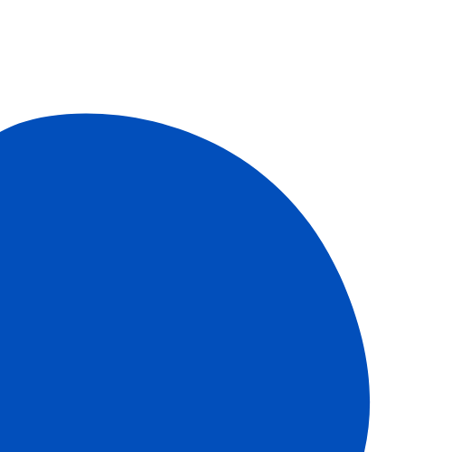 Close-up of a blue apple with a black background.