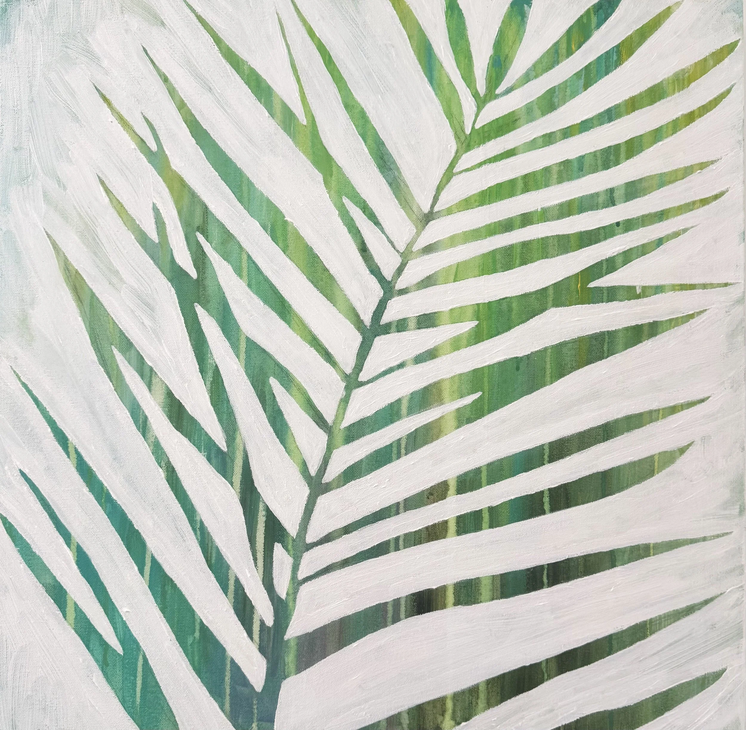 Close-up of a painted palm leaf with white background and green details.
