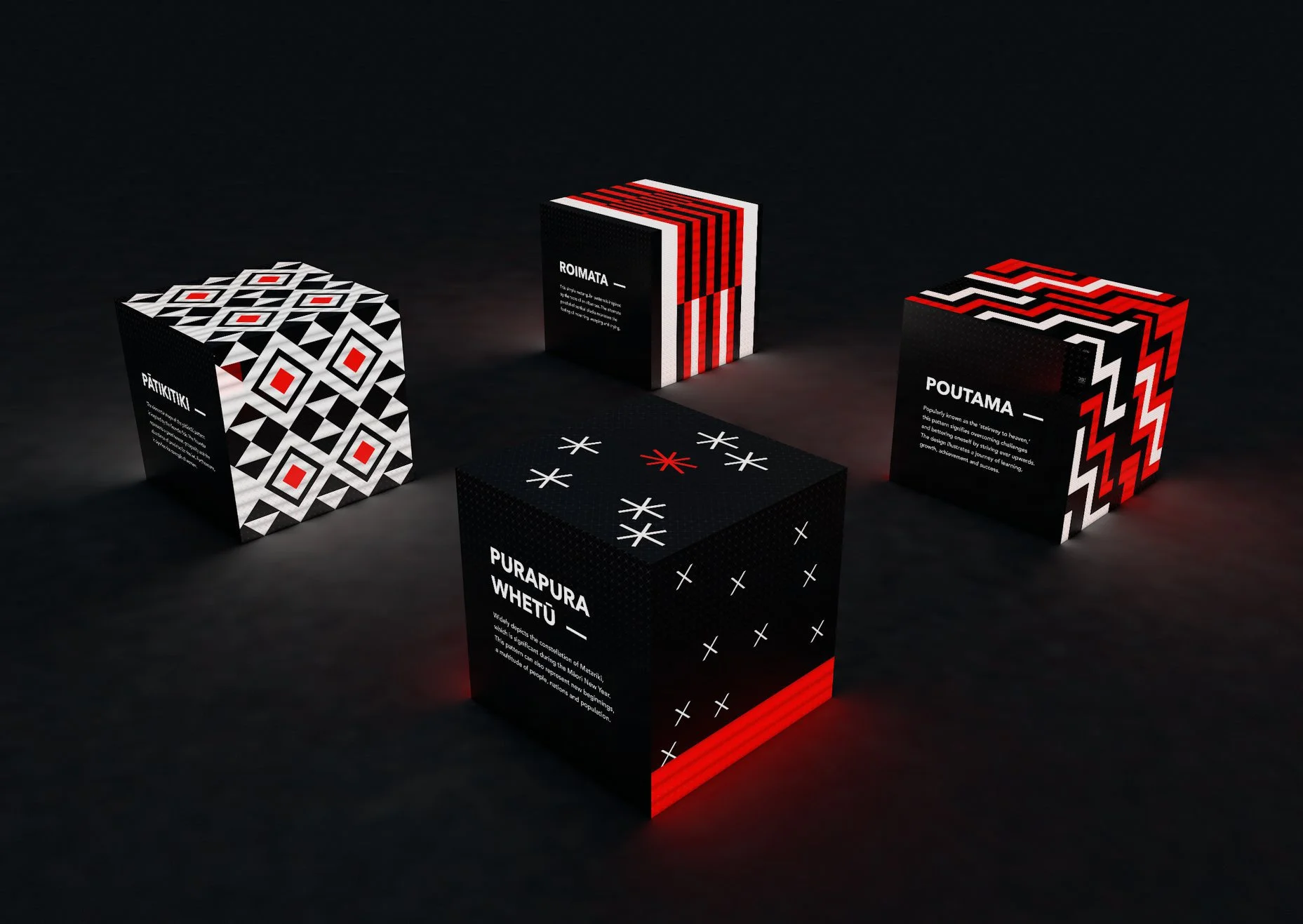 Four black boxes with geometric red, white, and black patterns, each labeled with different indigenous words and descriptions, arranged on a dark surface.