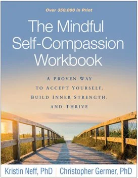 Cover of 'The Mindful Self-Compassion Workbook' with a wooden bridge leading to the horizon under a blue sky.