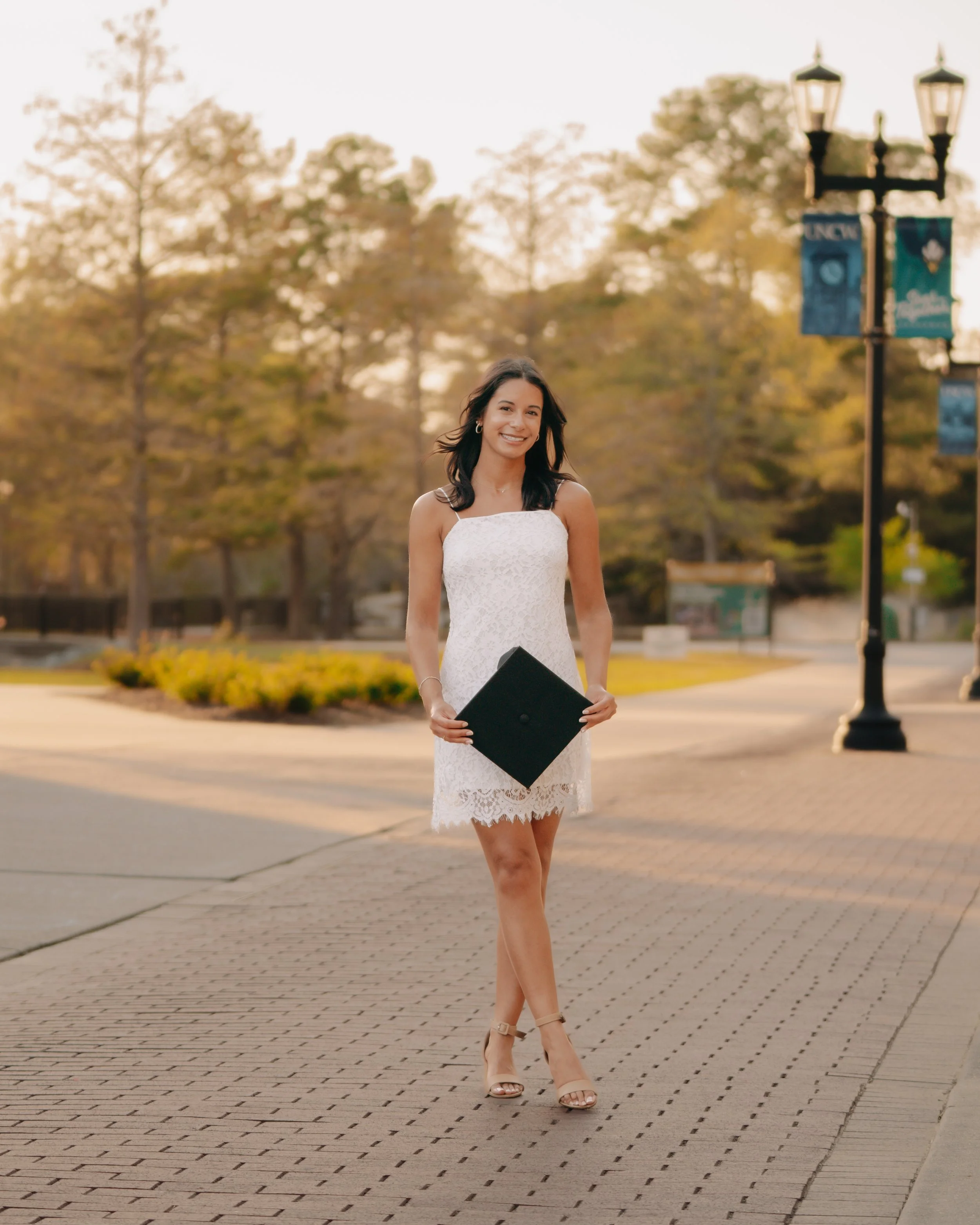 UNCW graduate posing - Wilmington, NC photographer