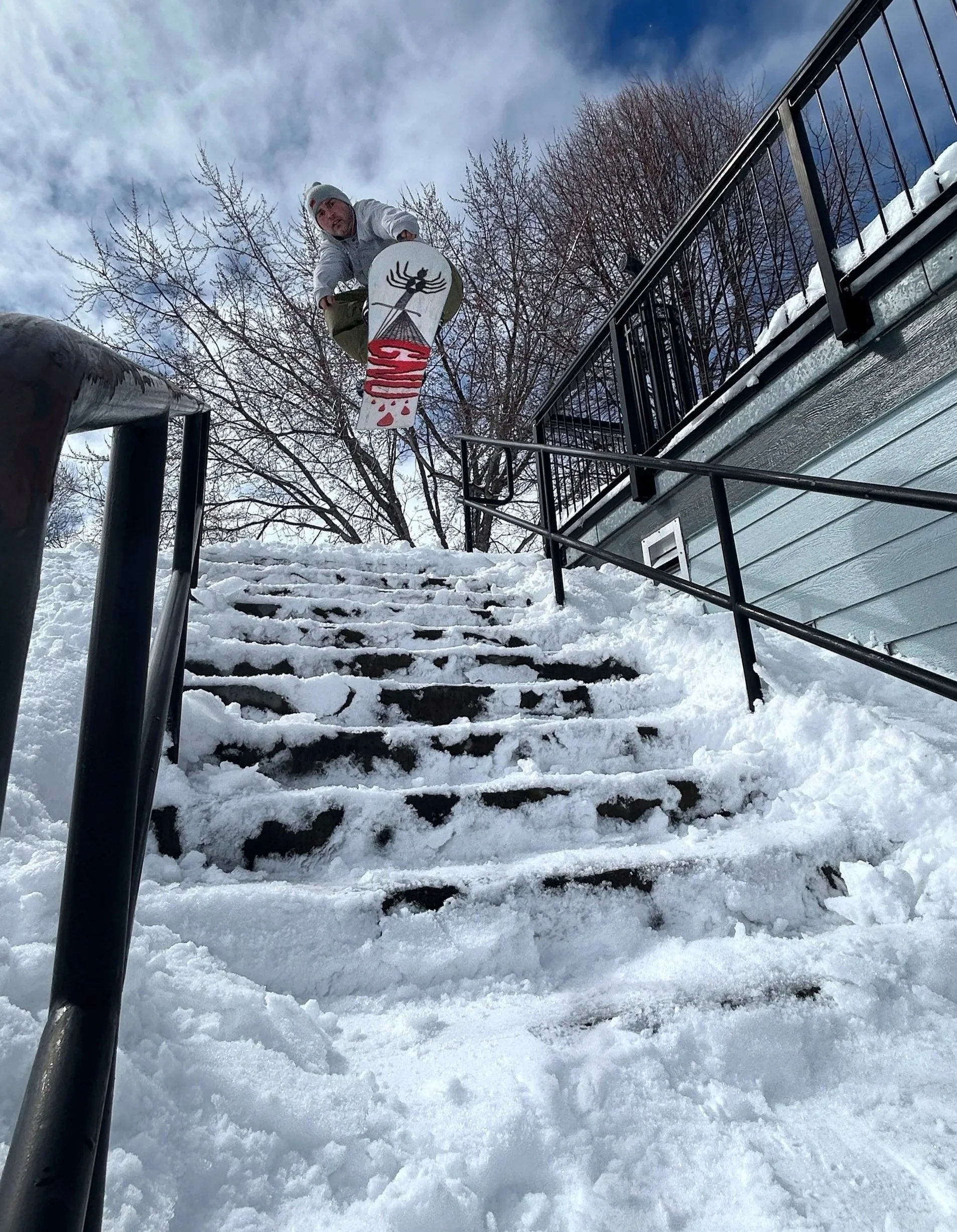 Jumping off snow-covered stairs