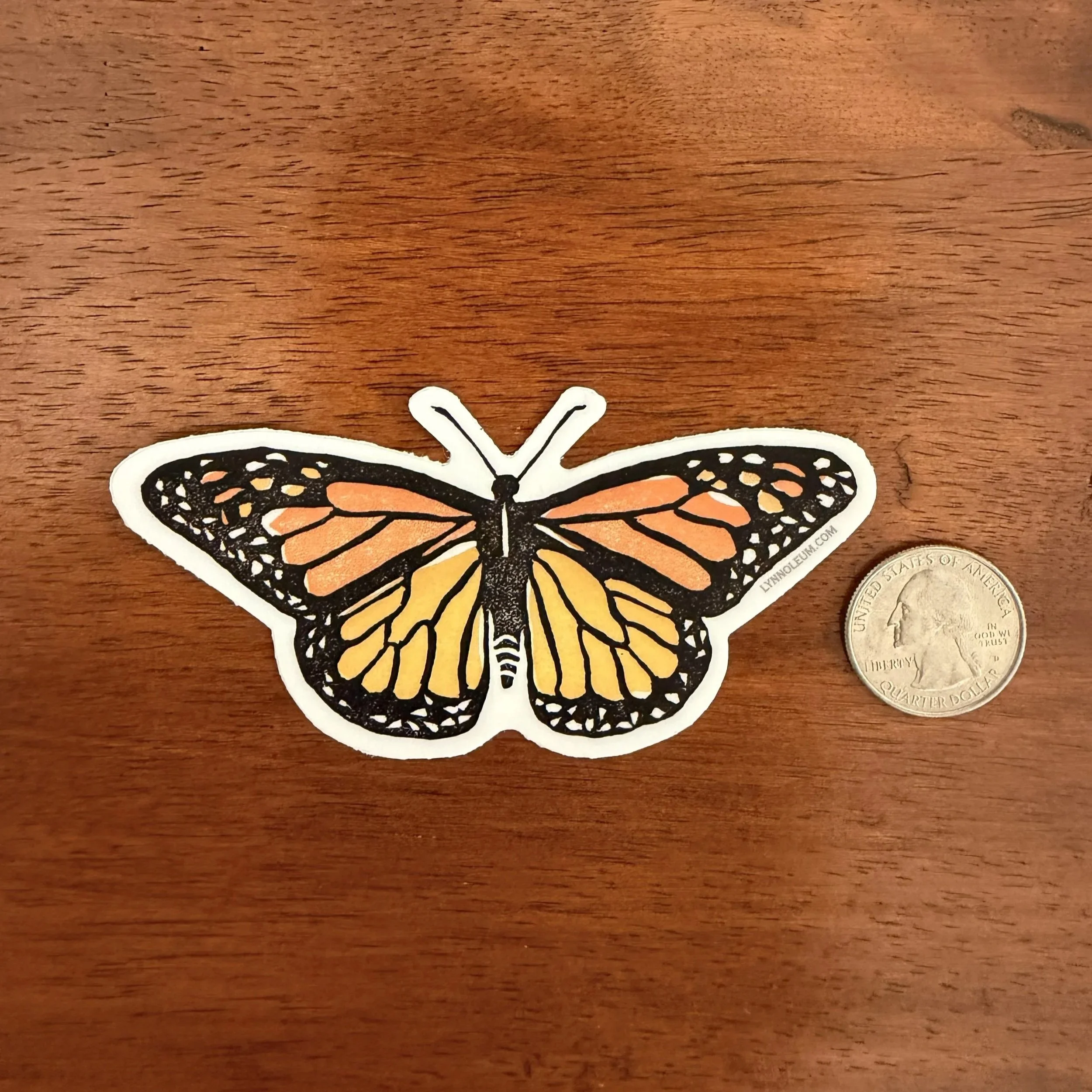 Monarch Butterfly Vinyl Sticker with quarter and wood background
