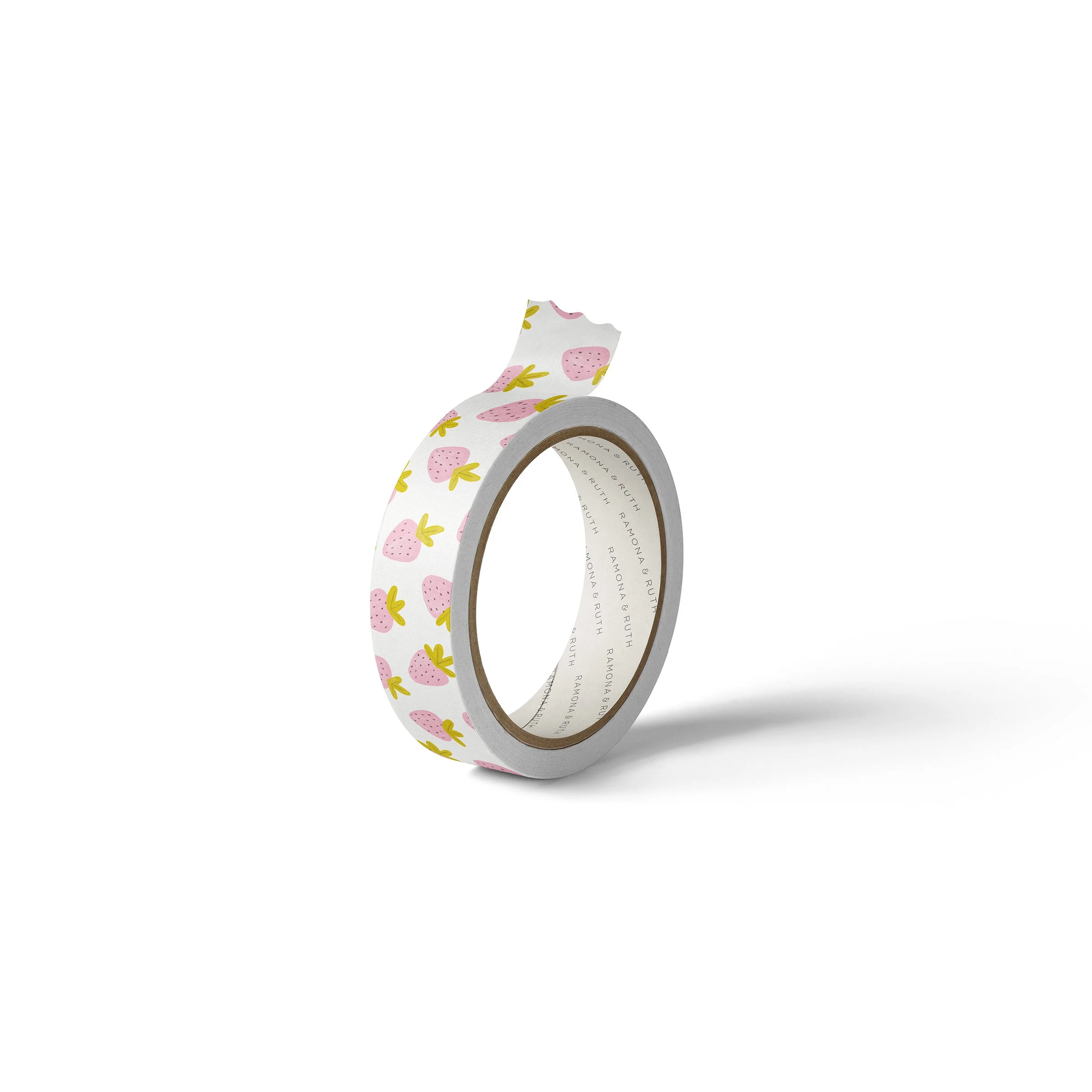 One roll of Ramona & Ruth's Strawberry Washi Tape on edge with white background