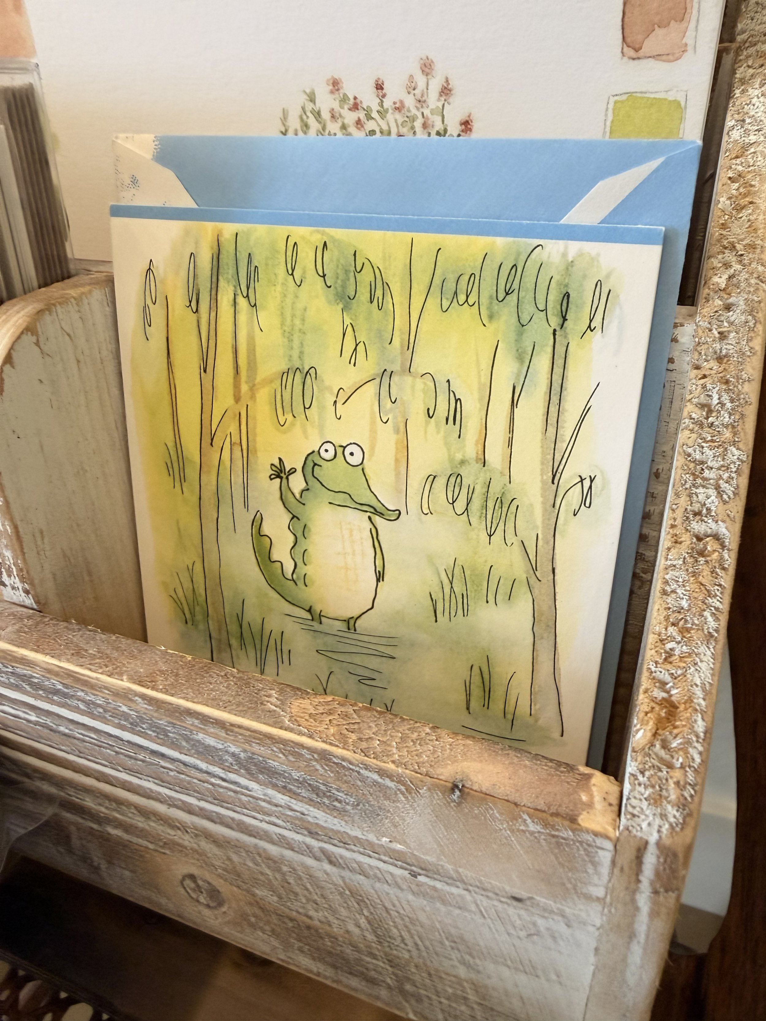 Alligator Waving greeting card on display at Bloomie's Boutique. (Photo credit: Melissa Mitchell-Hooge)