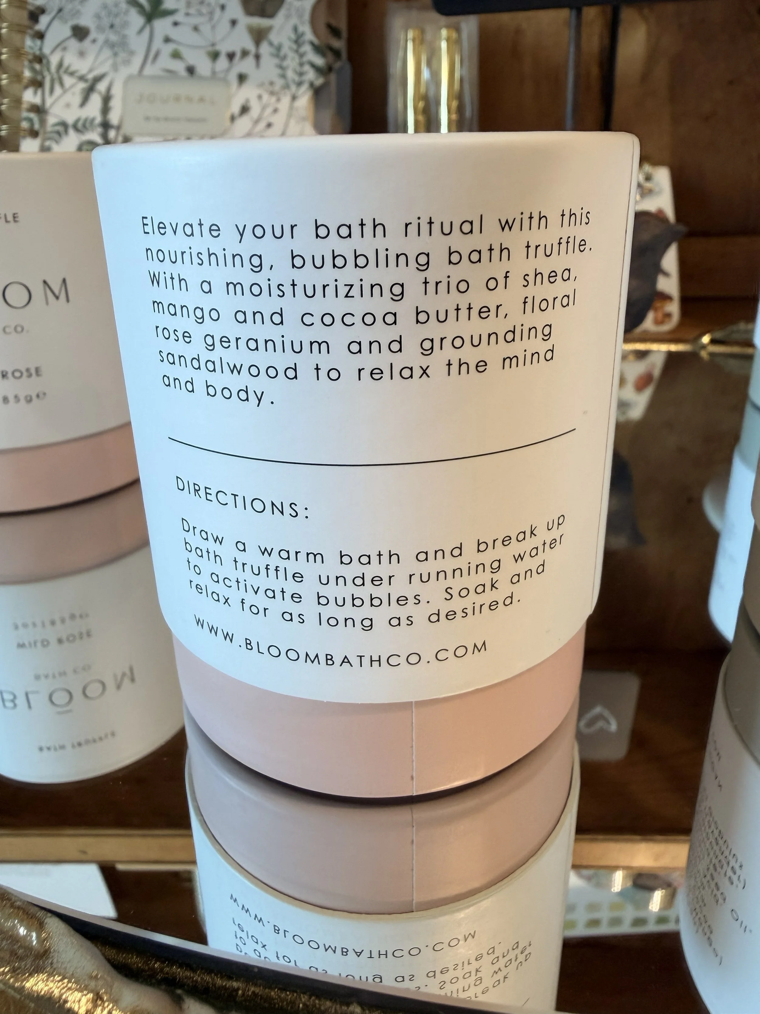 Back of Wild Rose Bath Truffle by Bloom Bath Co. on mirror display
