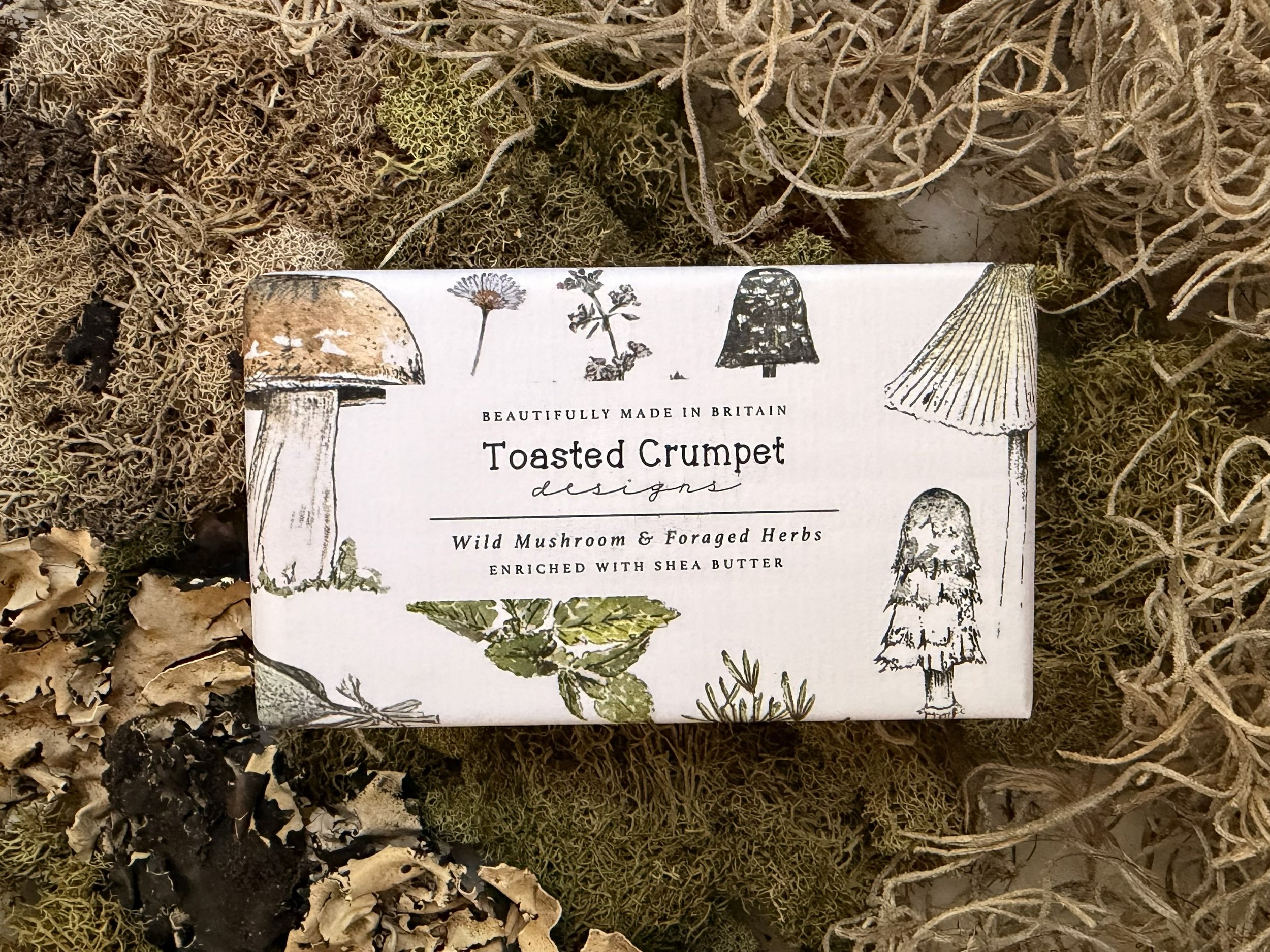 Front of Toasted Crumpet Wild Mushroom and Foraged Herbs Soap styled on moss