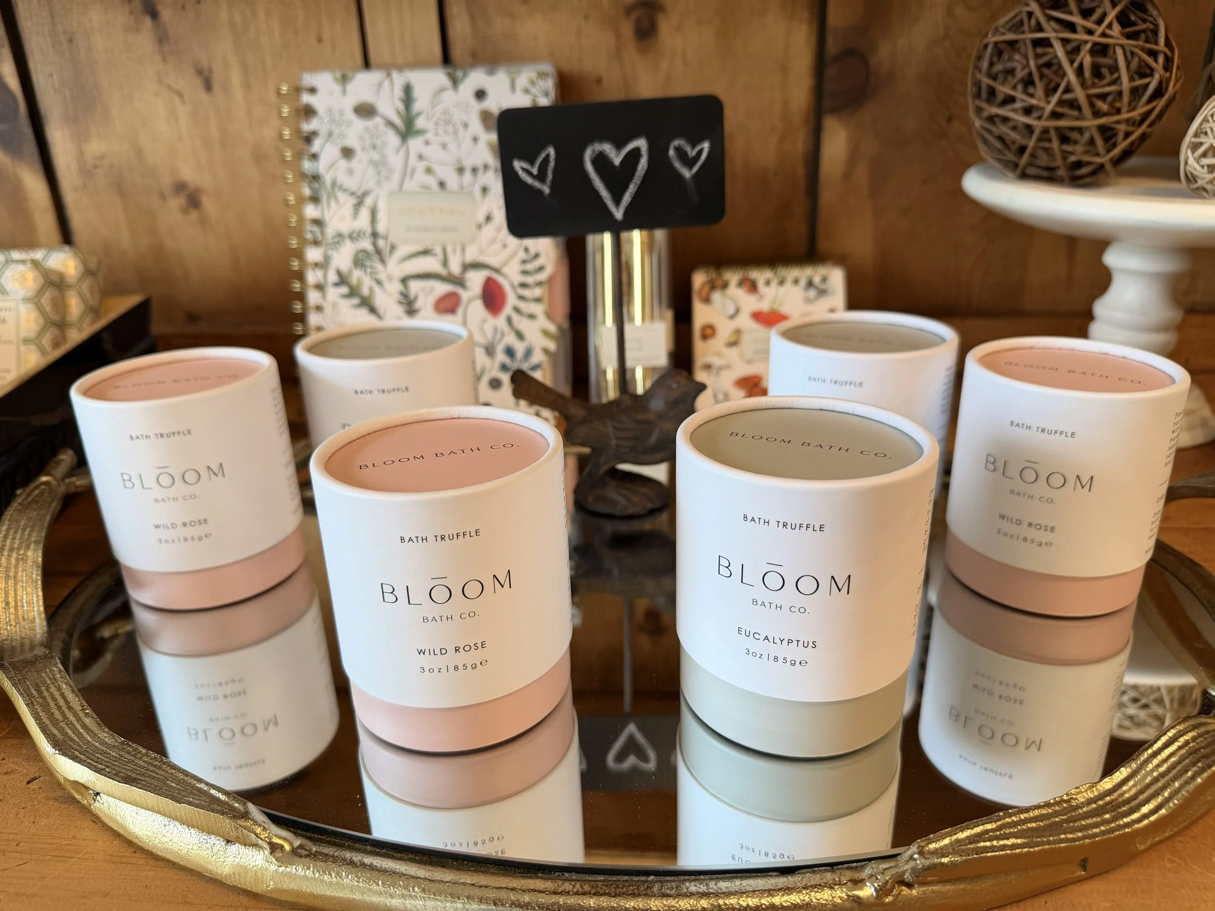 Eucalyptus Bath Truffles and Wild Rose Bath Truffles by Bloom Bath Co. on mirror display at Bloomie's Boutique