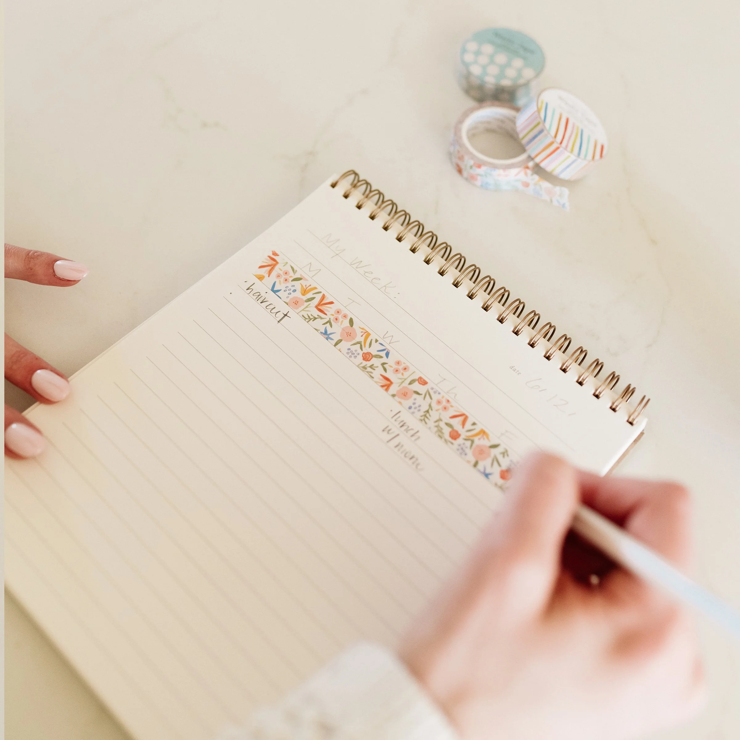 Ramona & Ruth's Spicy Floral Washi Tape styled in journal with woman writing in journal
