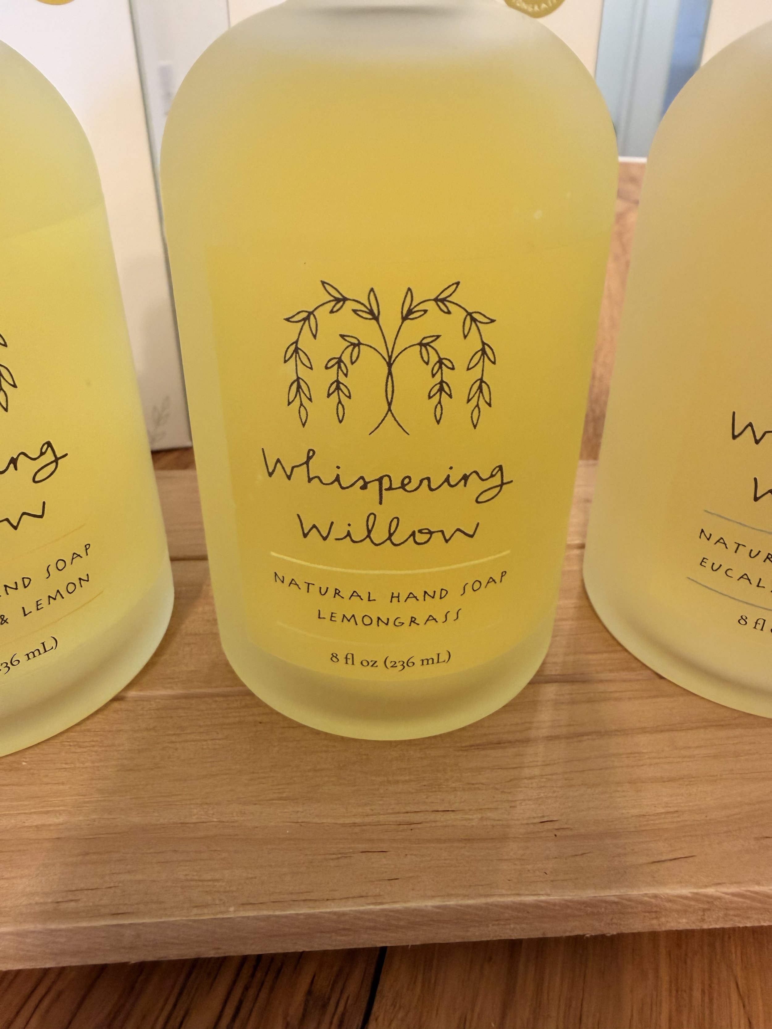 Close-up of Whispering Willow's Lemongrass Natural Pump Hand Soap on display at Bloomie's Boutique
