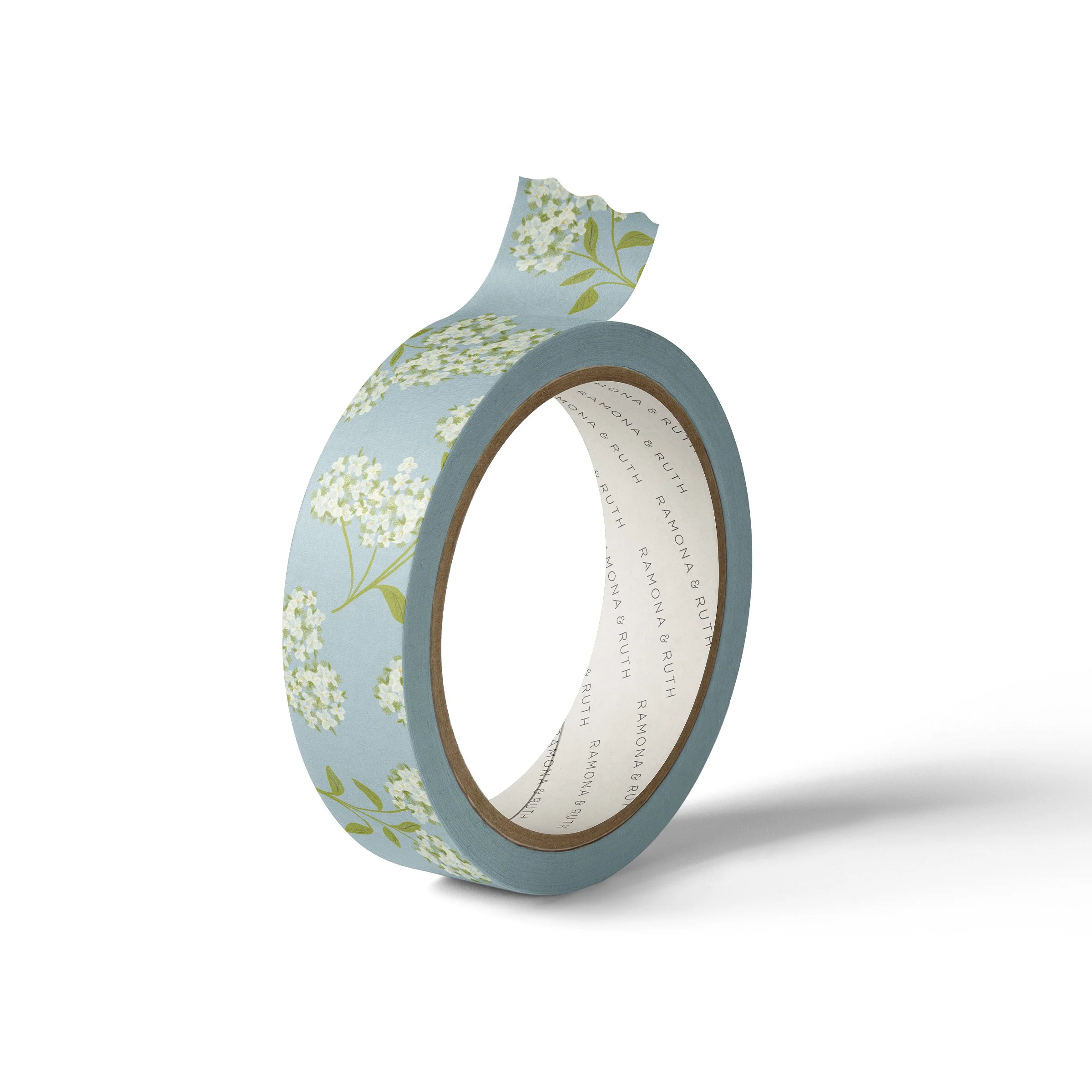 One roll of Ramona & Ruth's Hydrangea Washi Tape on edge with white background