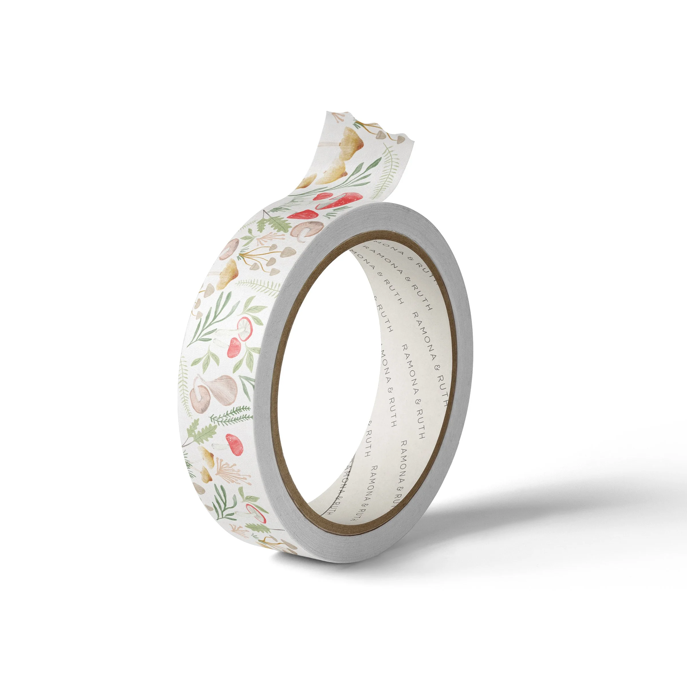 One roll of Ramona & Ruth's Mushroom Forest Washi Tape on edge with white background