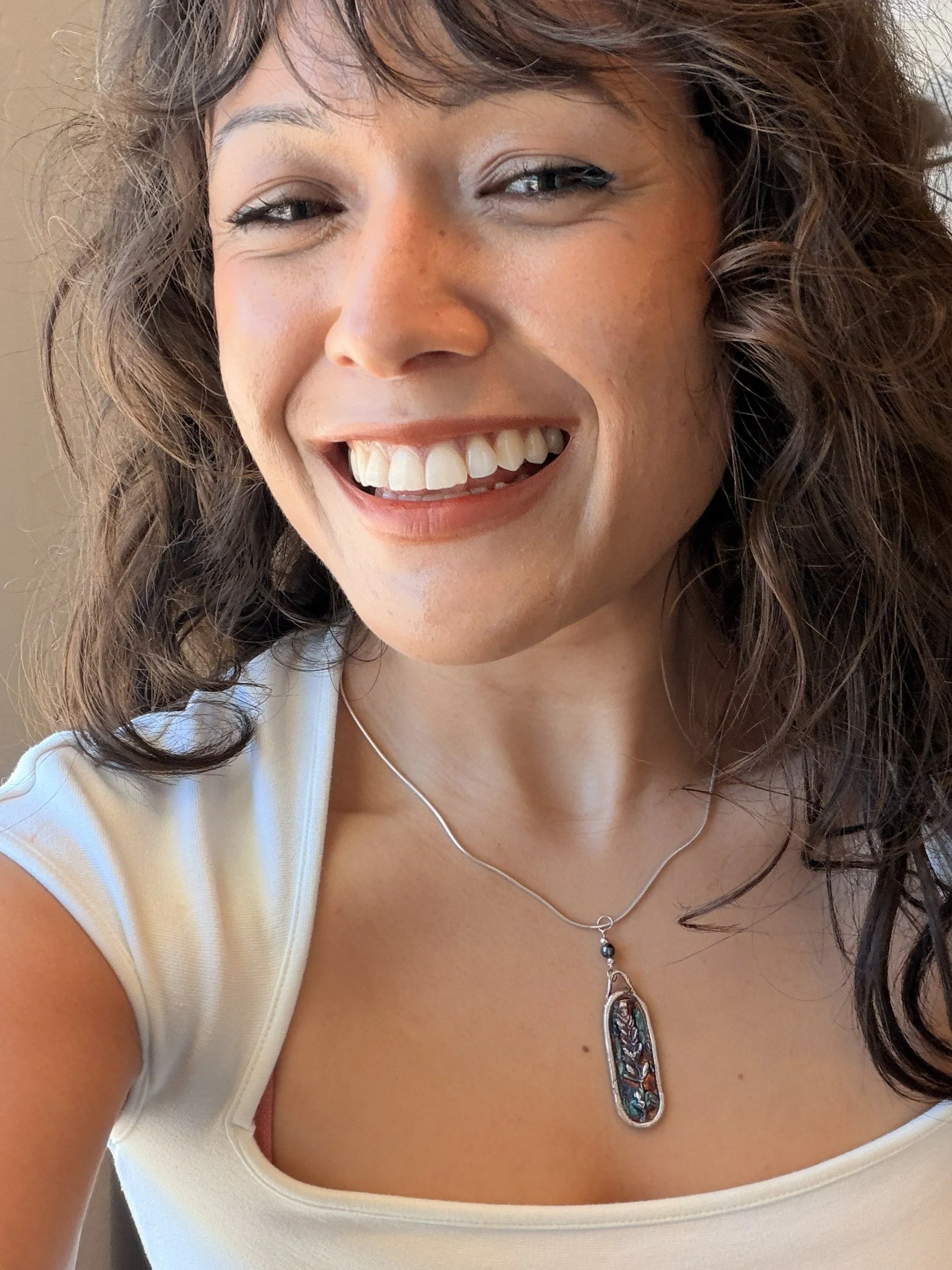 Tucci'Z Designs fine silver pendant with lavender design on sterling silver necklace worn by model and available at Bloomie's Boutique