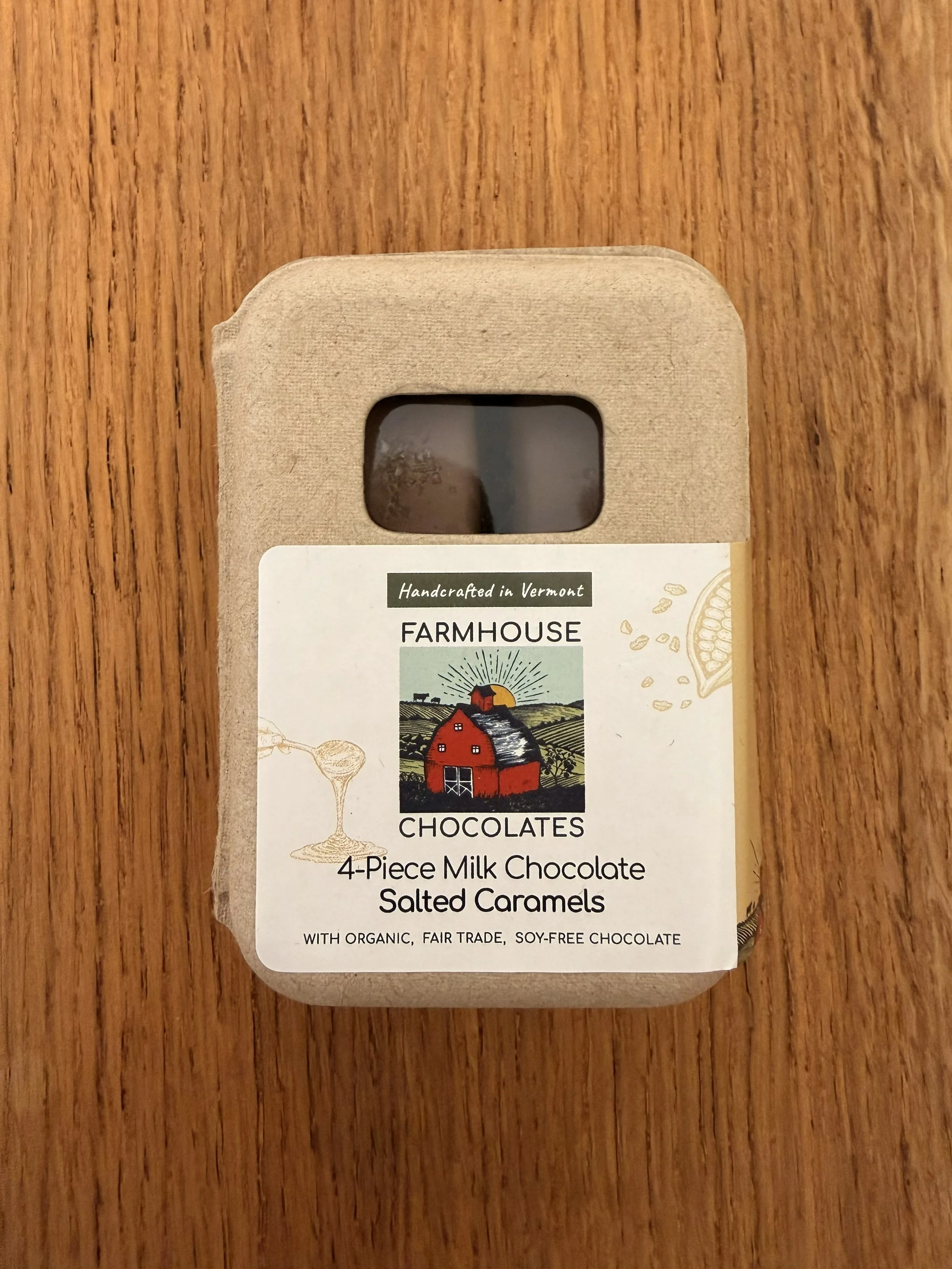Farmhouse Chocolates' 4-Piece Milk Chocolate Salted Caramels on wood countertop