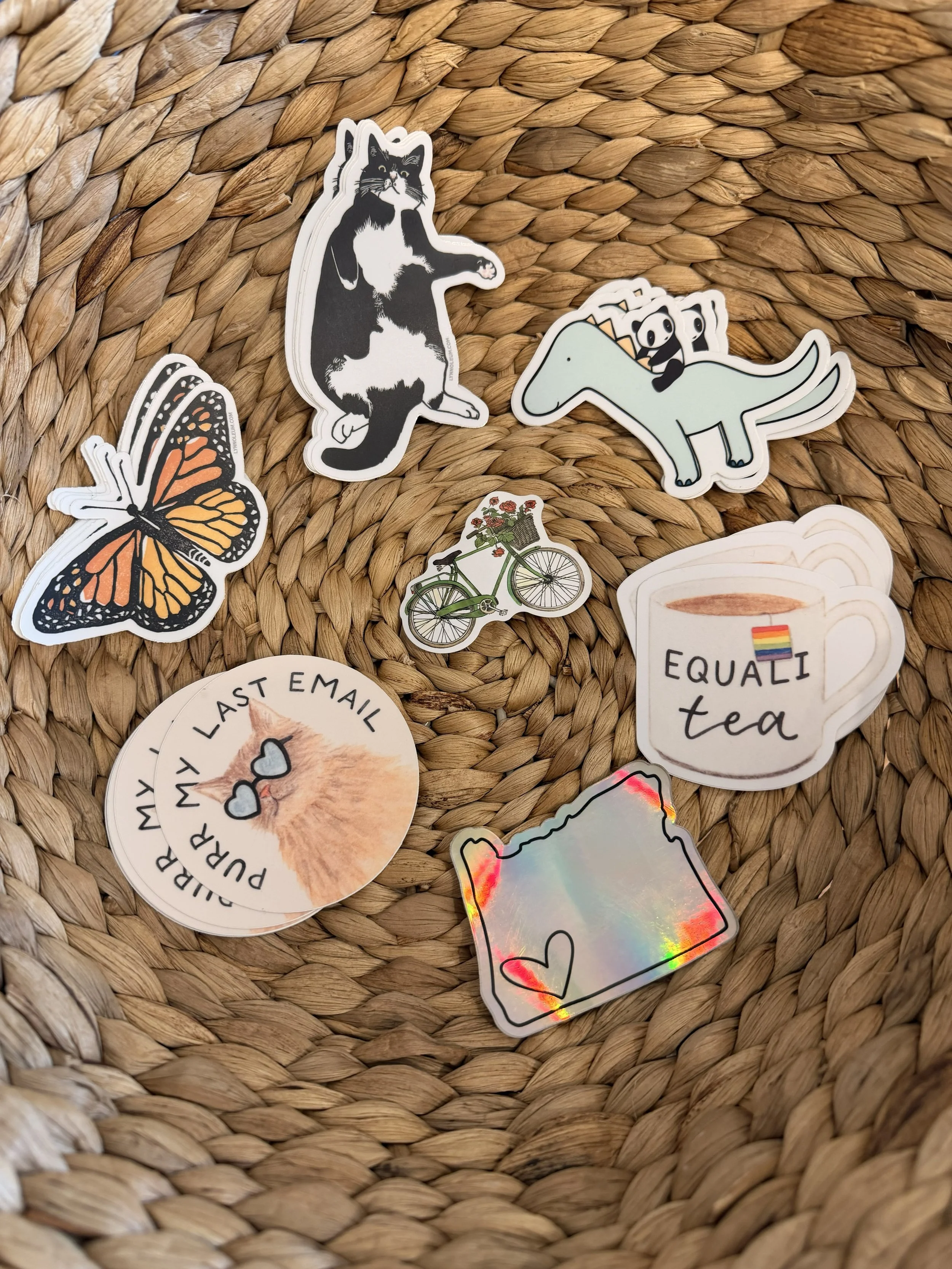 Various stickers on display in round basket at Bloomie's Boutique. (Photo credit: Melissa Mitchell-Hooge)
