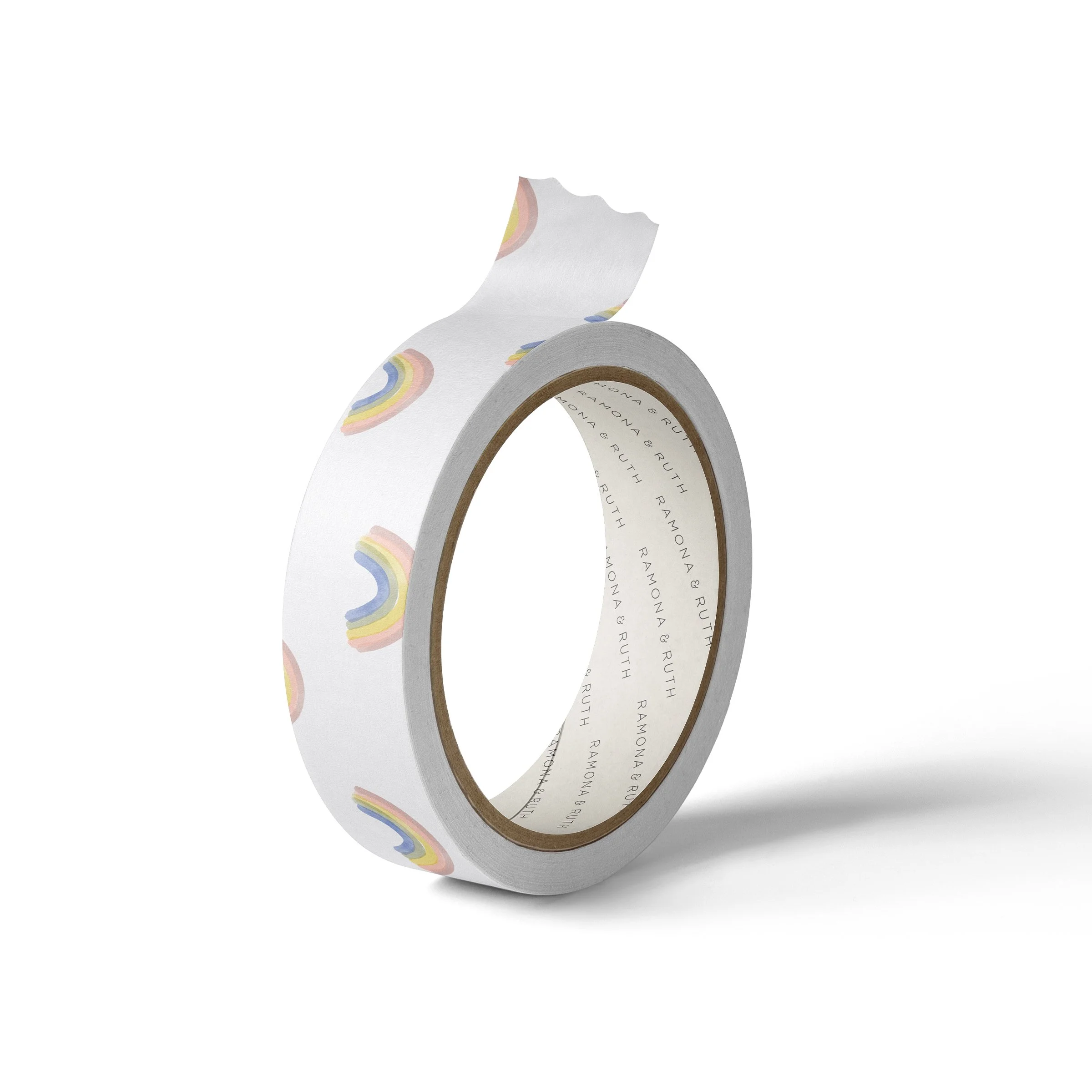 One roll of Ramona & Ruth's Rainbows Washi Tape on edge with white background